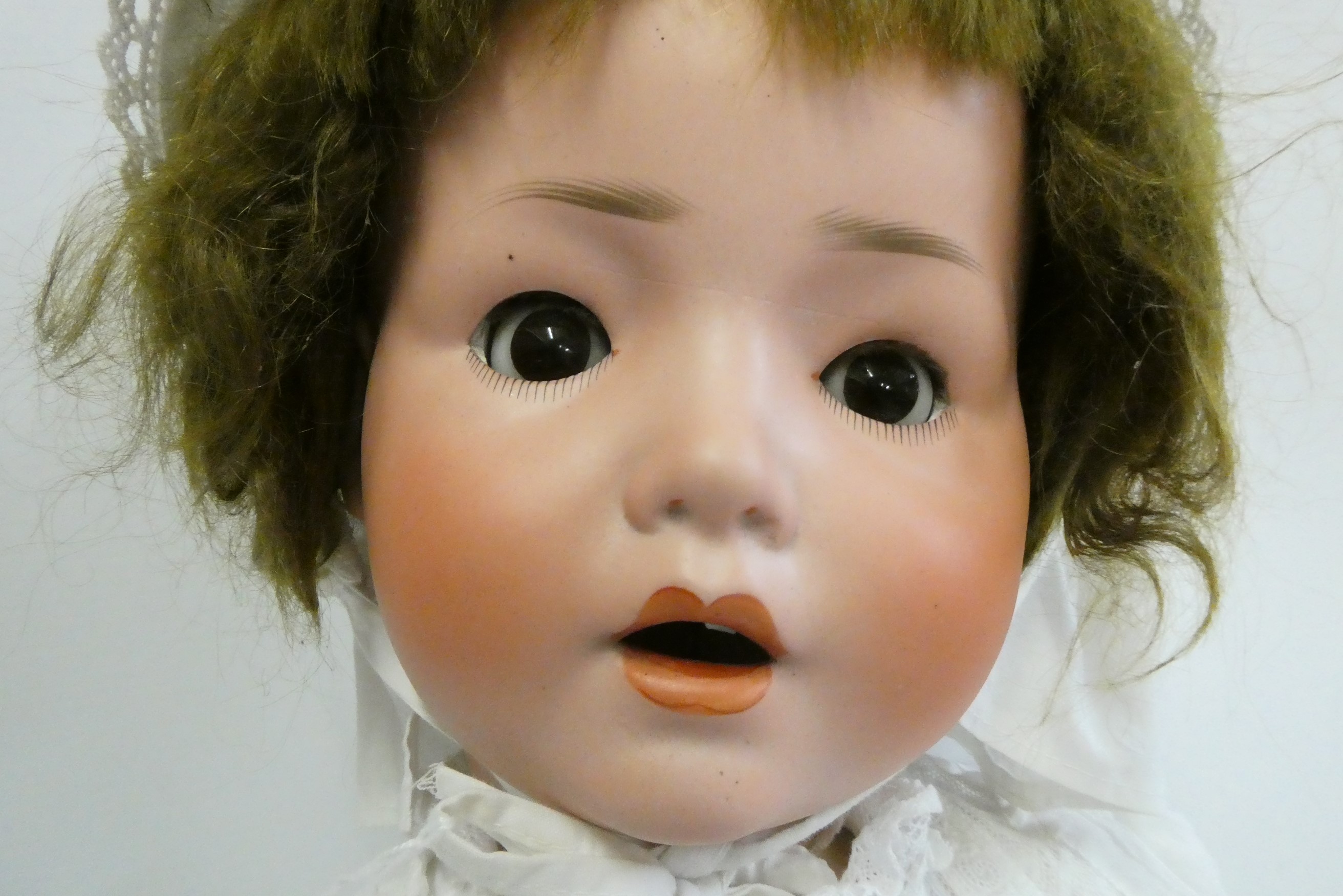 A Schoenau & Hoffmeister bisque socket head doll, brown glass sleeping eyes, open mouth, composition Image