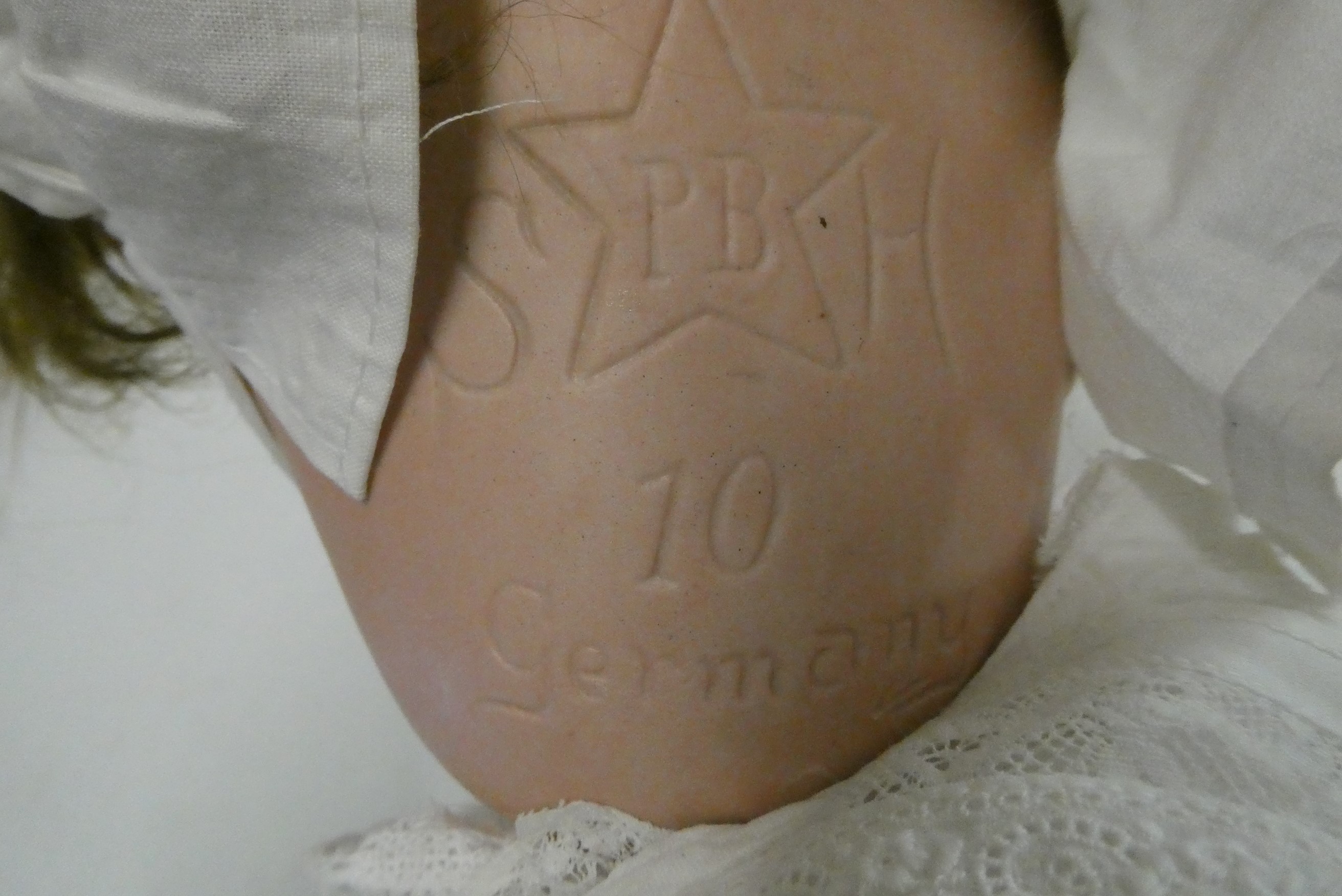 A Schoenau & Hoffmeister bisque socket head doll, brown glass sleeping eyes, open mouth, composition Image