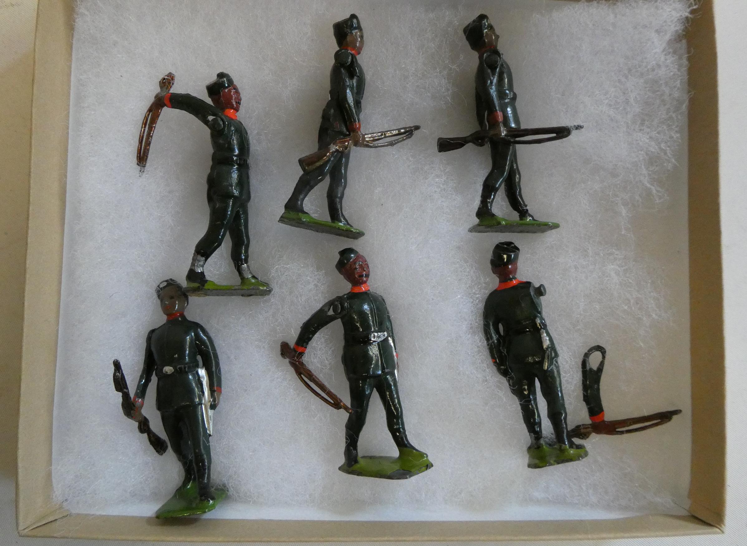 Britains Gurkha rifles figures comprising six soldiers with swinging arms and rifles, one item has Image