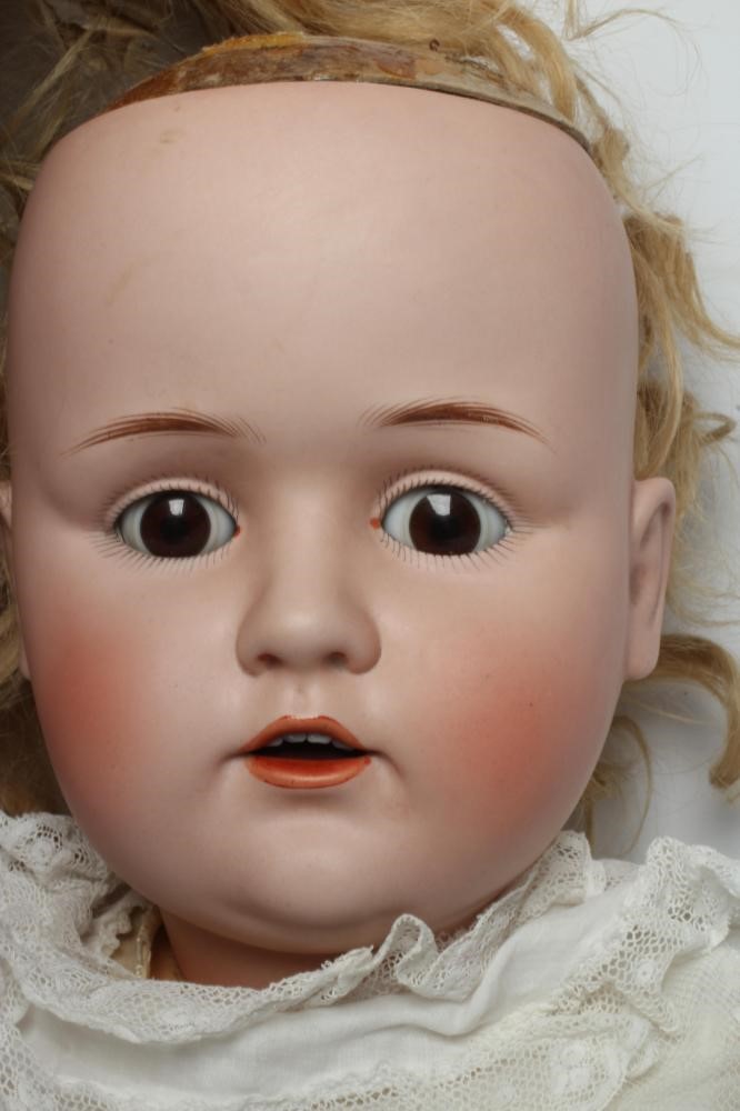 A J. D. Kestner bisque socket head doll, with brown glass sleeping eyes, open mouth, applied teeth, Image