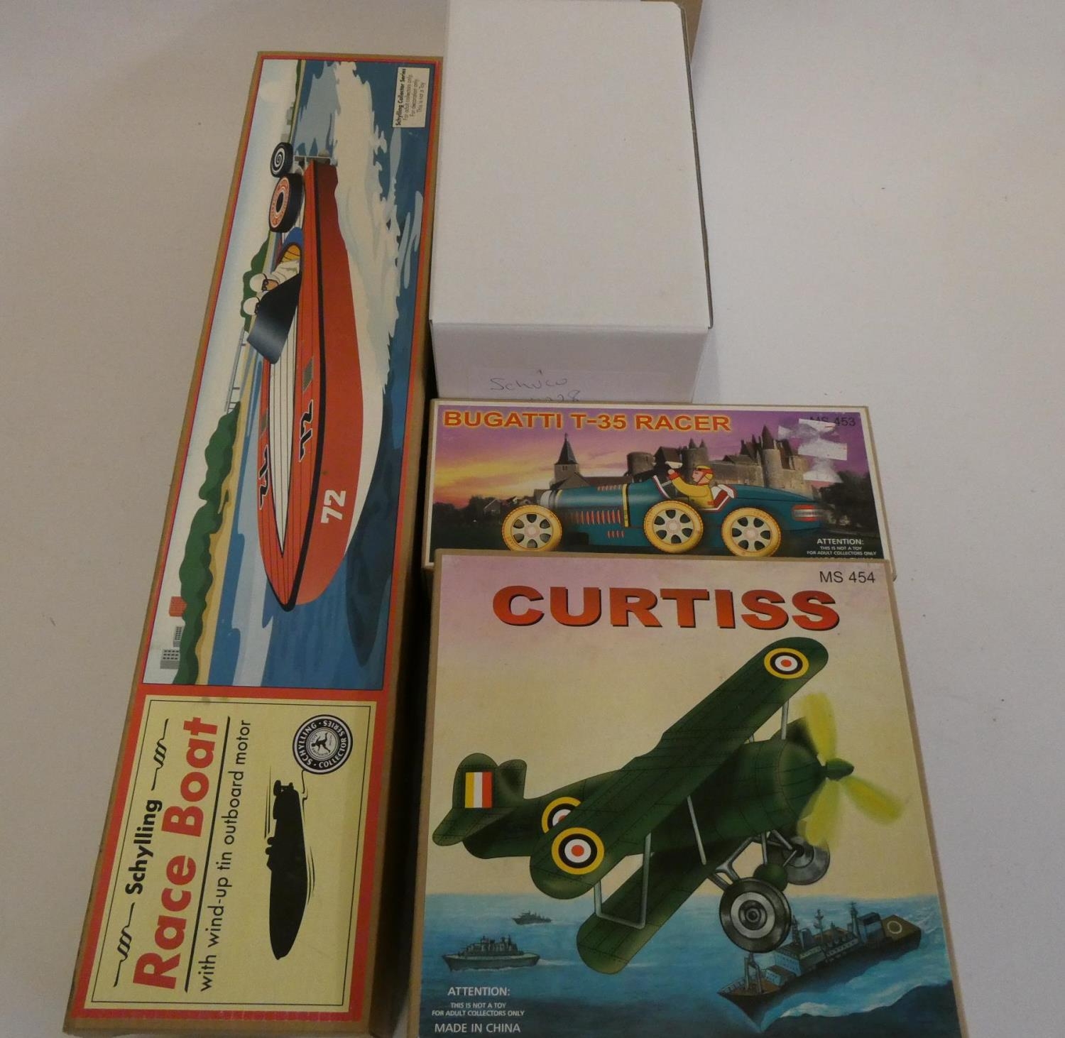 Four late issue tinplate toys comprising of speed boat, Bugatti Racer, Curtiss airplane and Schuco Image