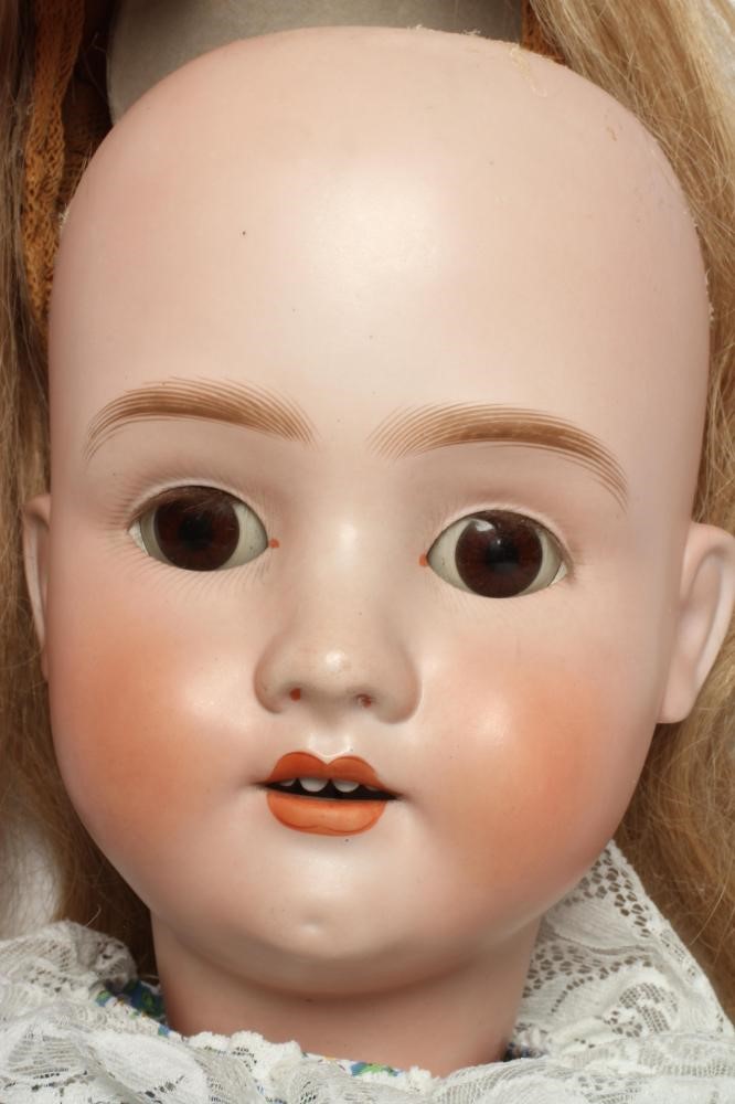 A large Schoenau & Hoffmeister bisque socket head doll Image