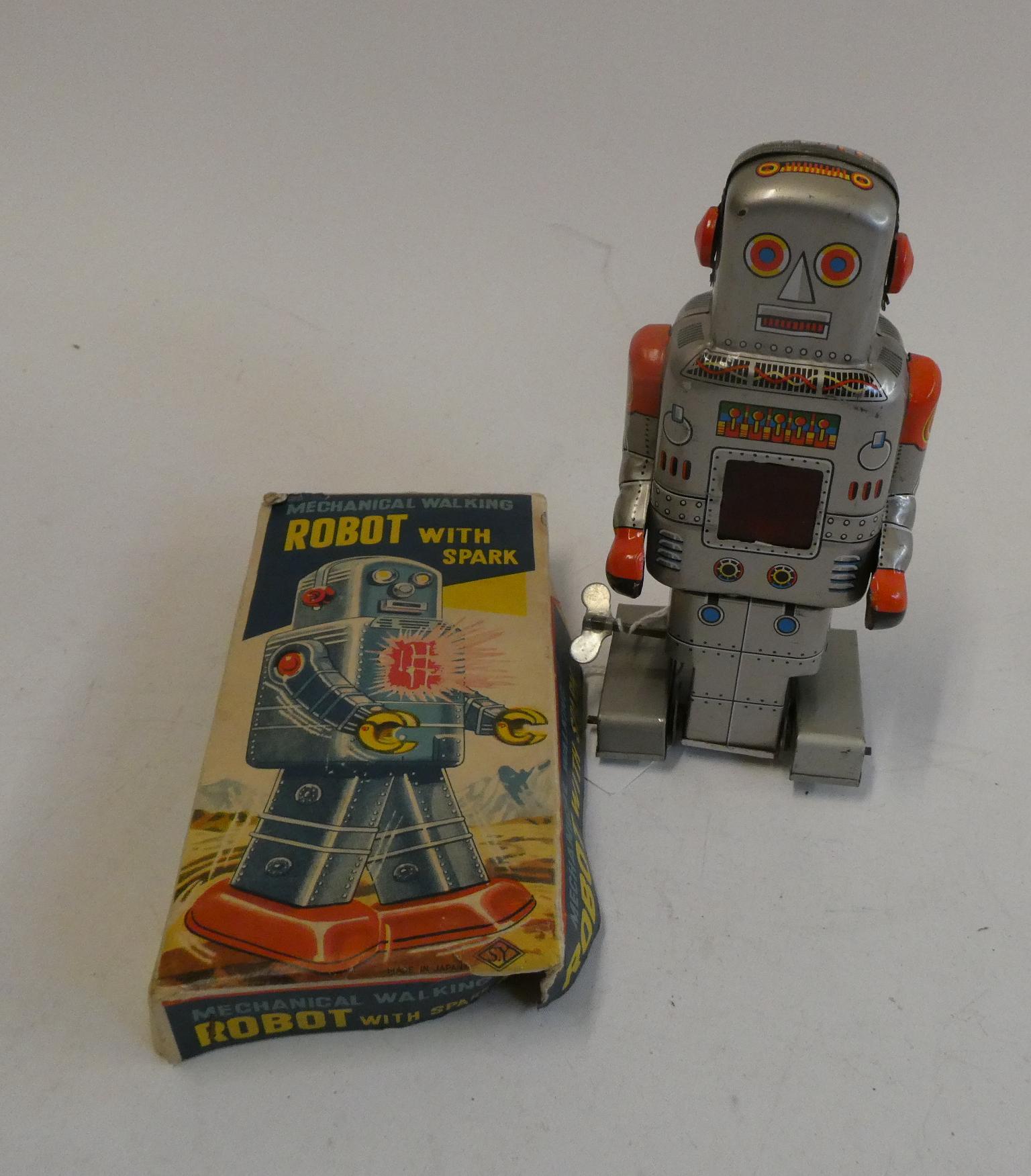 Yoneya clockwork mechanical walking and spark making robot. Clockwork motor appears to be a little Image