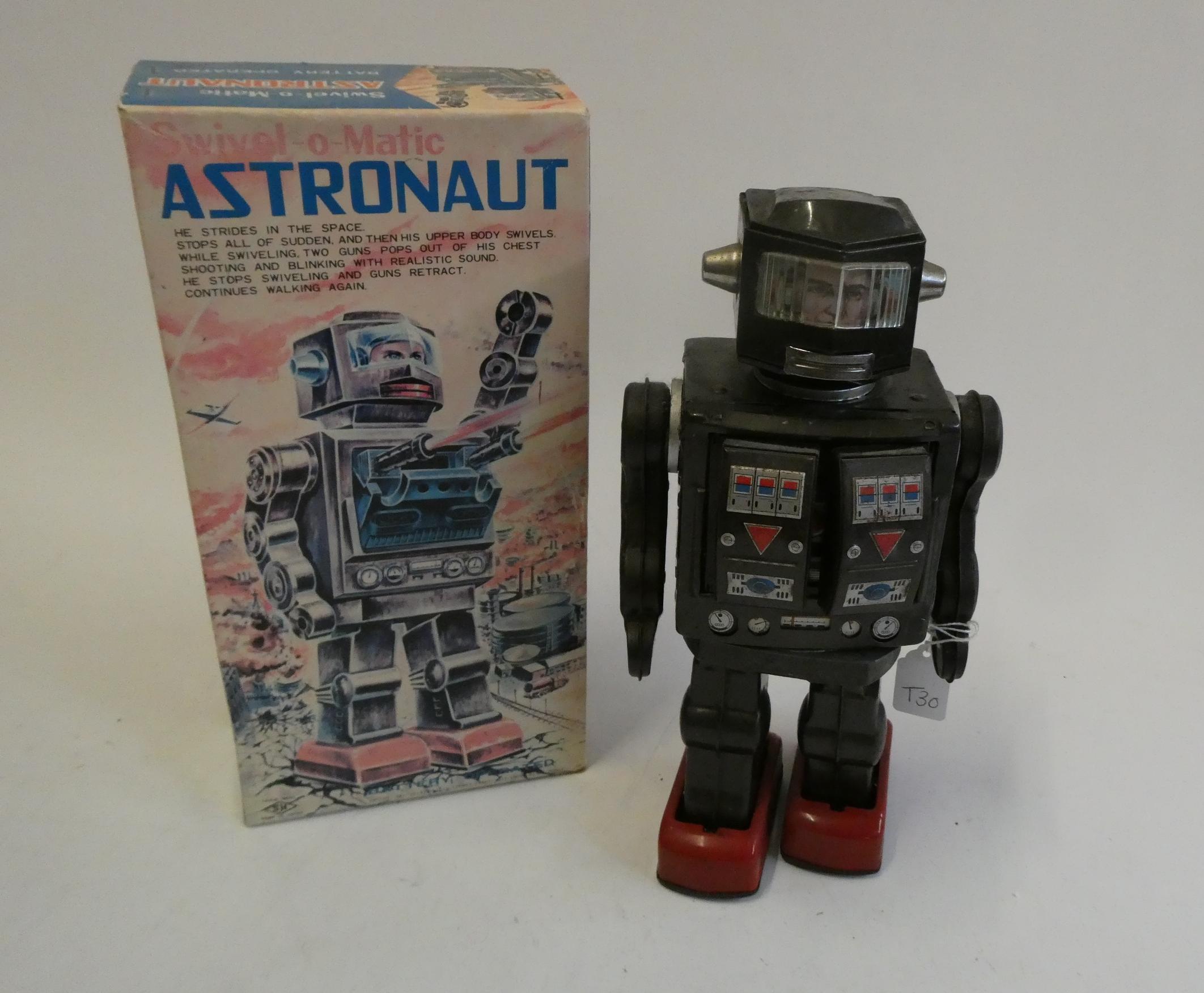 Honkawa (SH) battery operated Swivel-O-Matic Astronaut, tin construction with plastic arms and Image