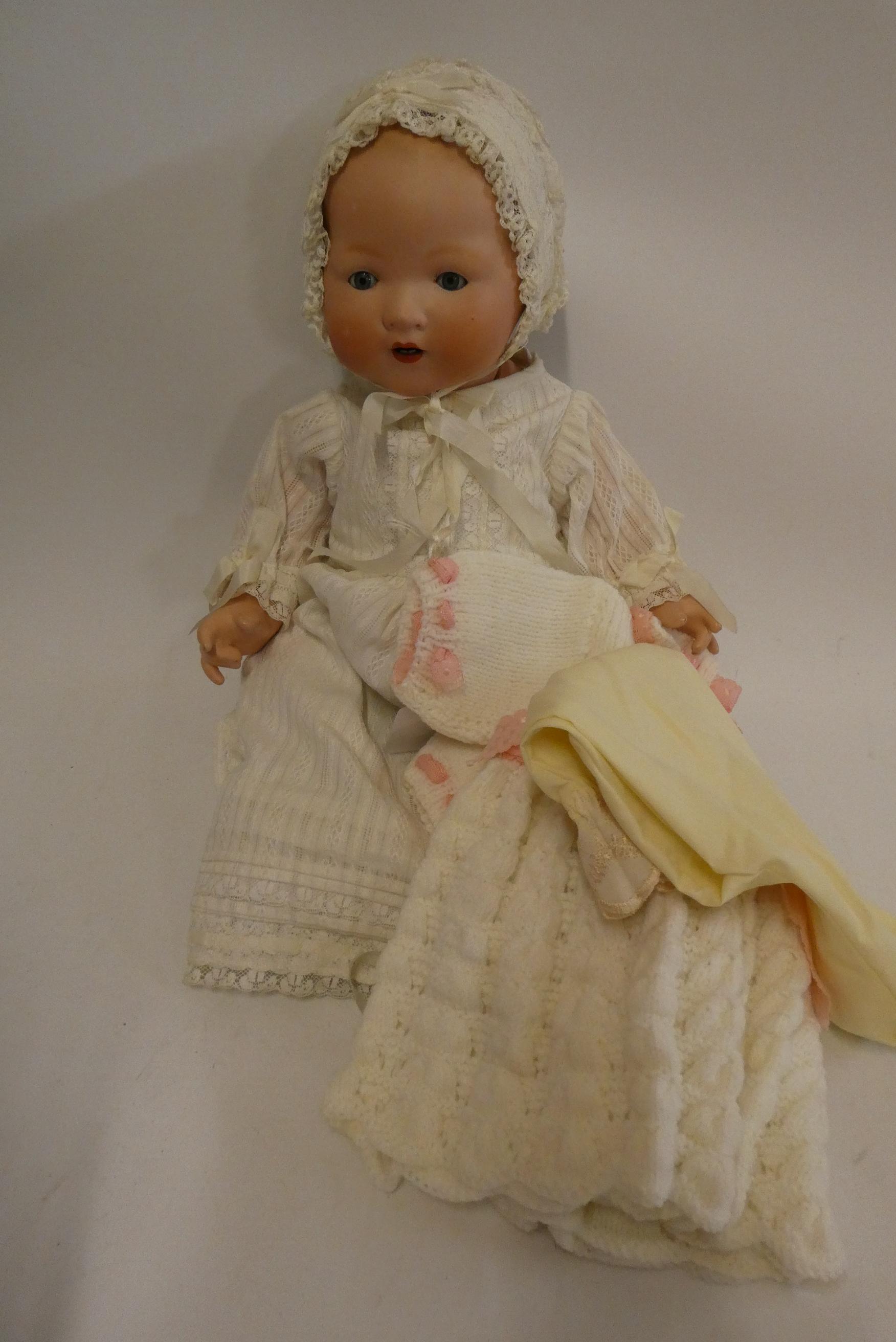 An Armand Marseille bisque socket head baby doll Image