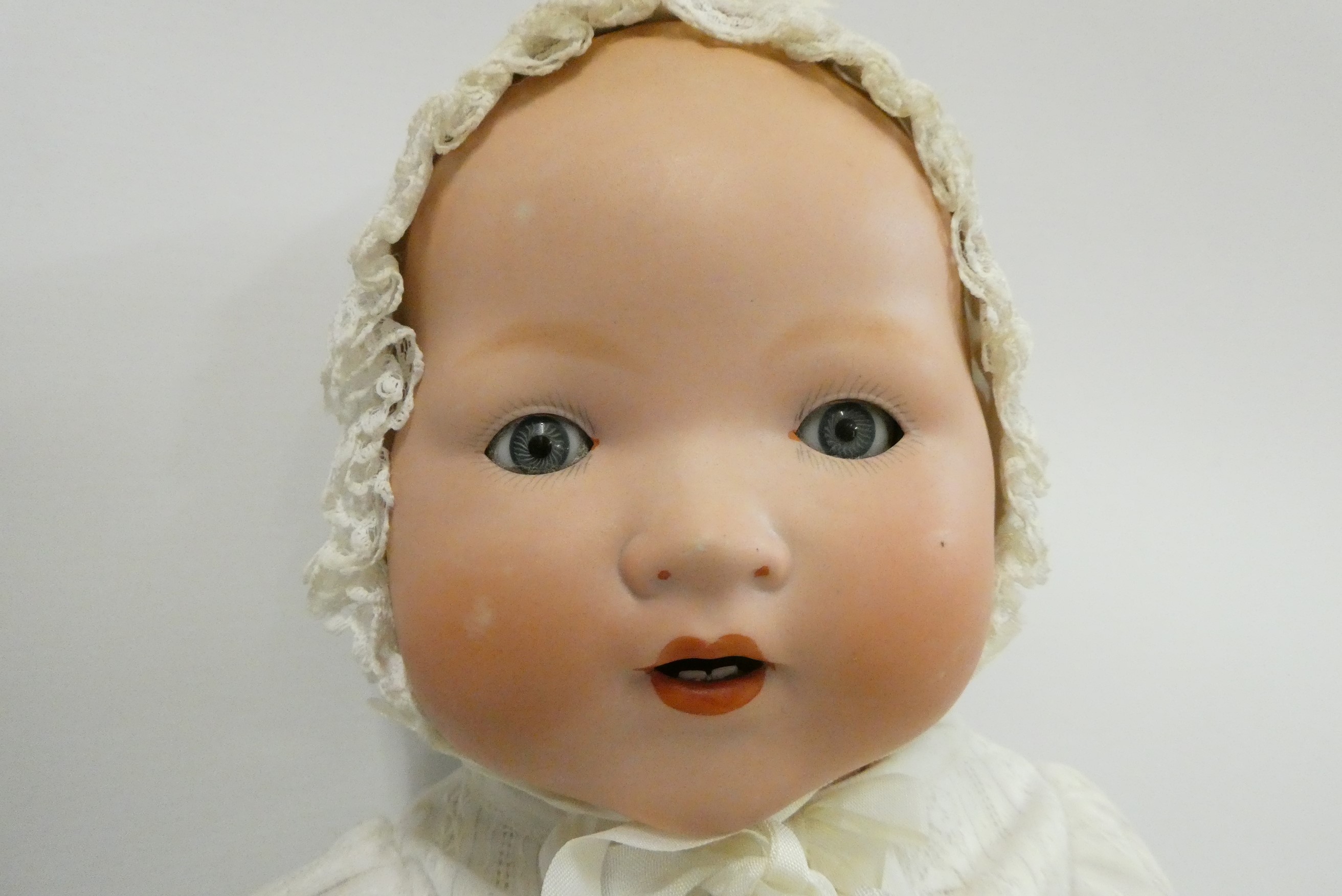 An Armand Marseille bisque socket head baby doll Image