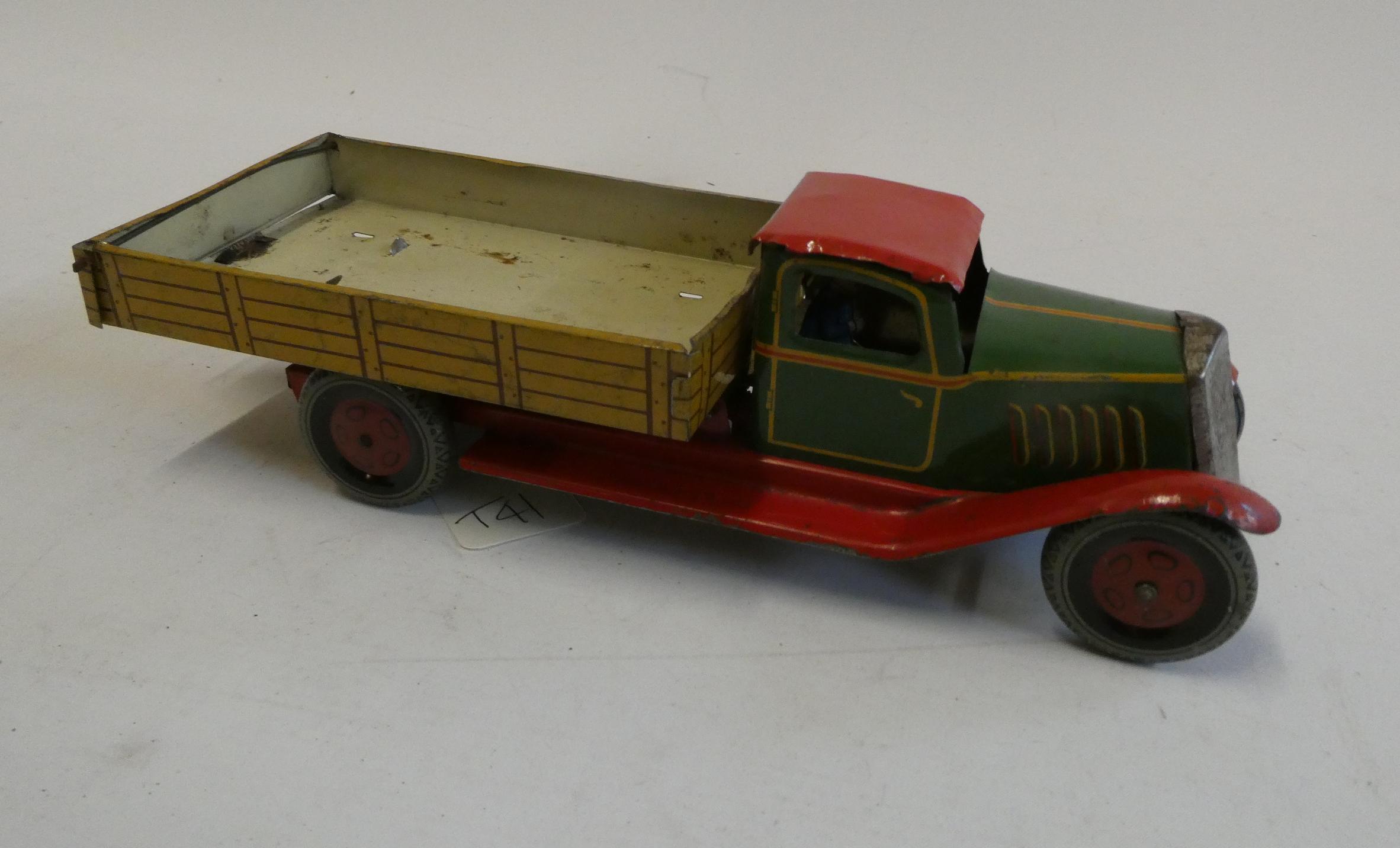 Wells clockwork tipper lorry, some repair and small part missing to underside of back, minor paint Image