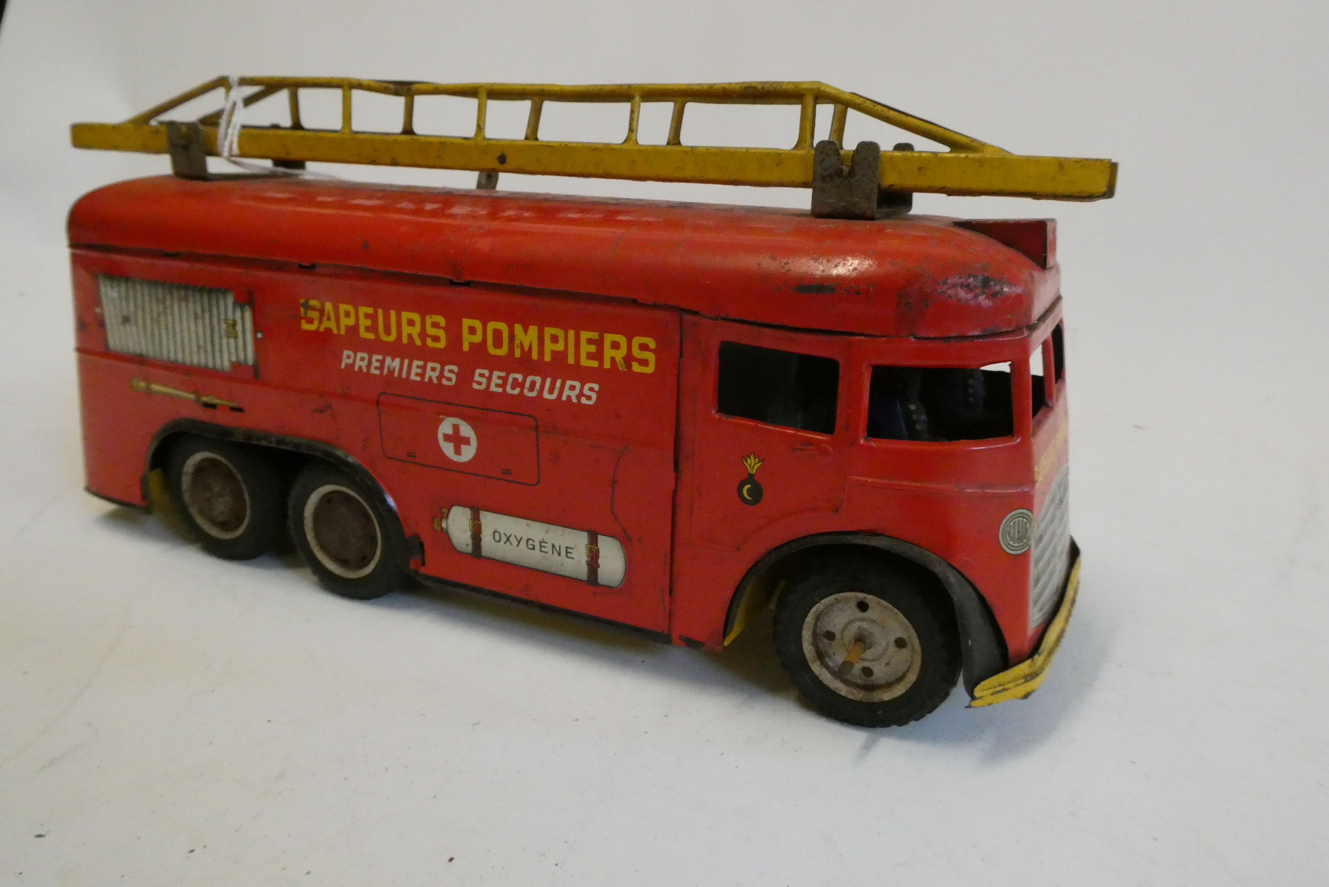 Joustra France Sapeurs Pompiers clockwork fire engine, some rusting to bodywork and paint chips, one Image