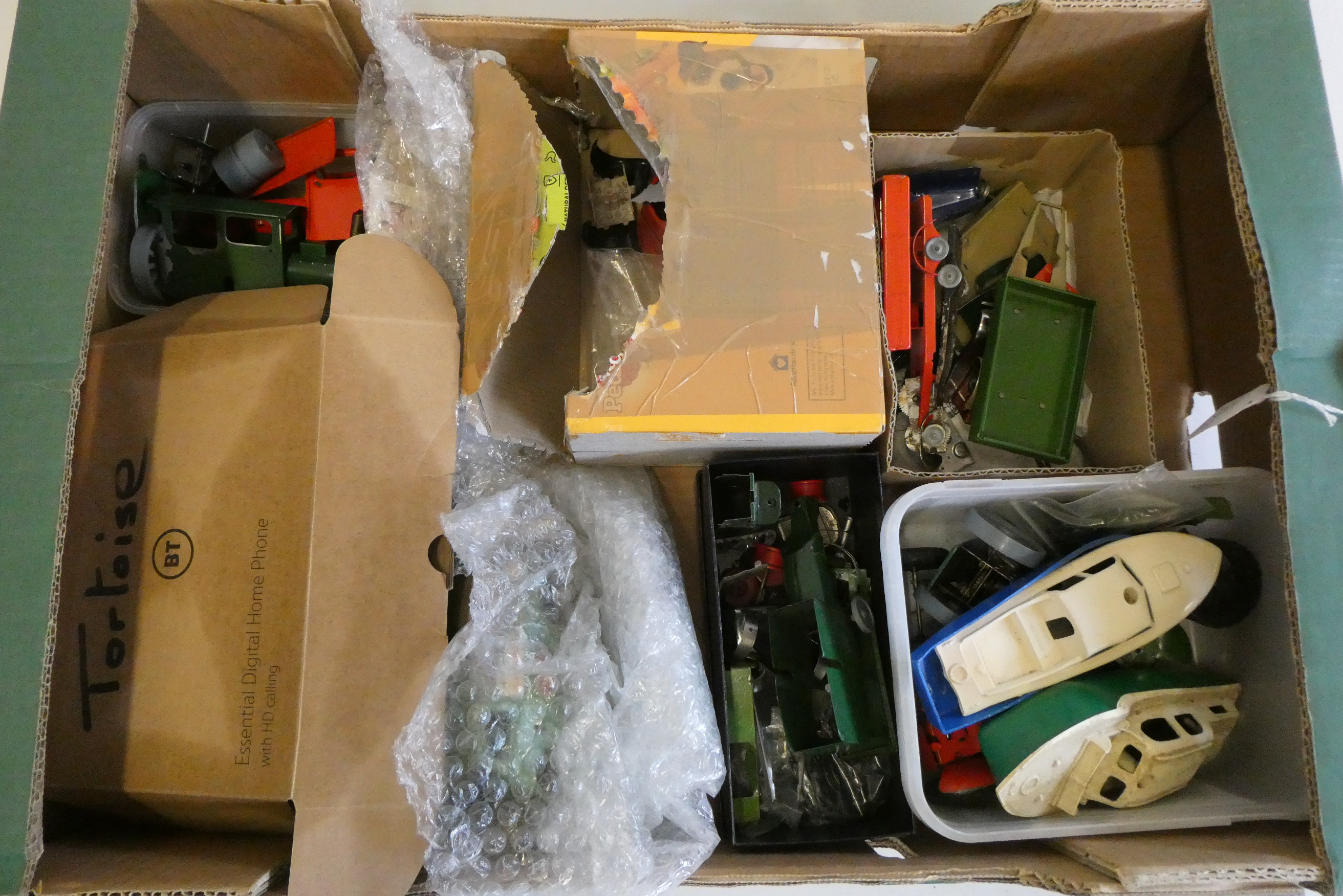 A large quantity of spare parts mostly for Triang Minic items, includes bodywork motors, wheels etc, Image