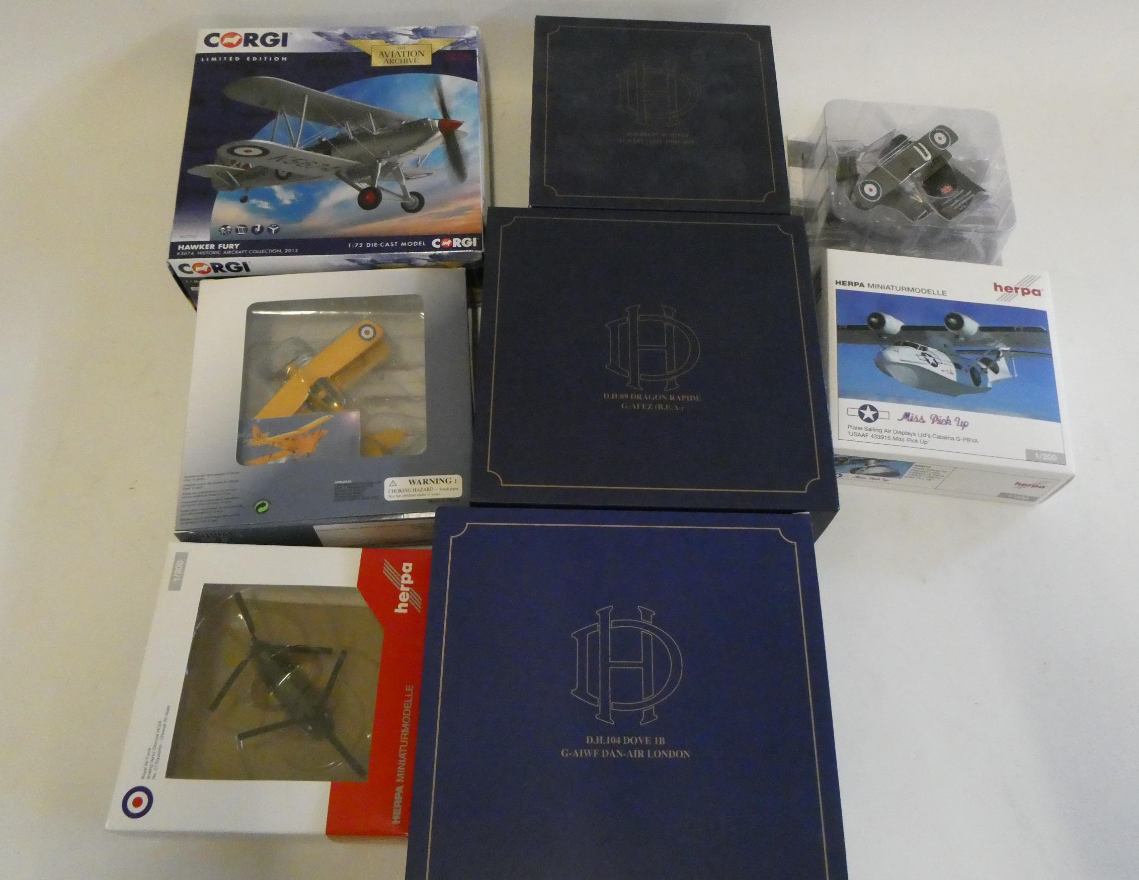 Eight diecast Aircraft models by various makers including Amy Johnsons Puss Moth, Dragon Rapid, Image