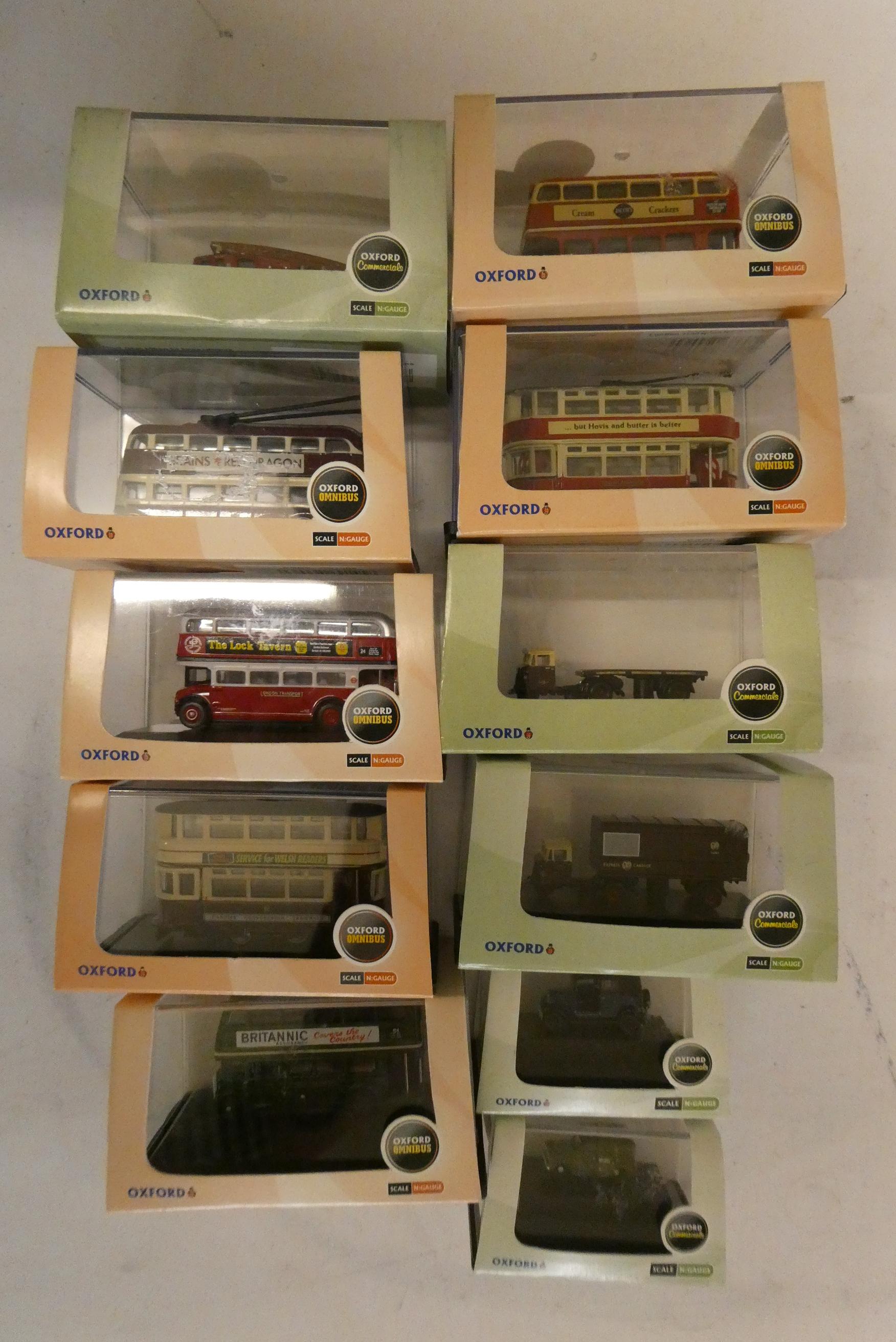 Eleven N scale Oxford Classic vehicles including buses, cars and wagons, all items boxed, mint Image