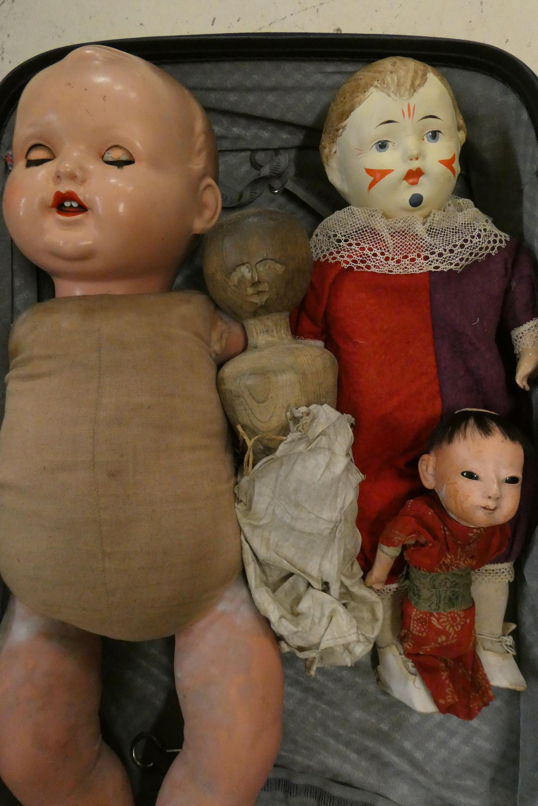 Four collectors dolls, comprising a part Victorian peg doll, a composition Japanese doll, a Image