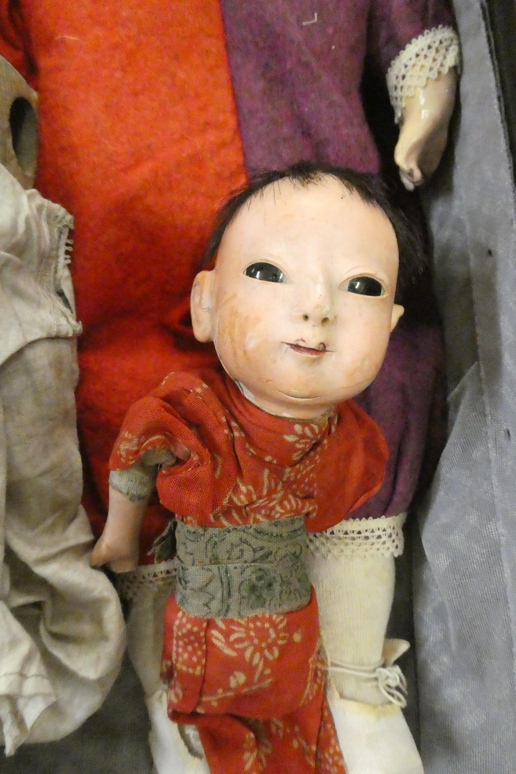 Four collectors dolls, comprising a part Victorian peg doll, a composition Japanese doll, a Image