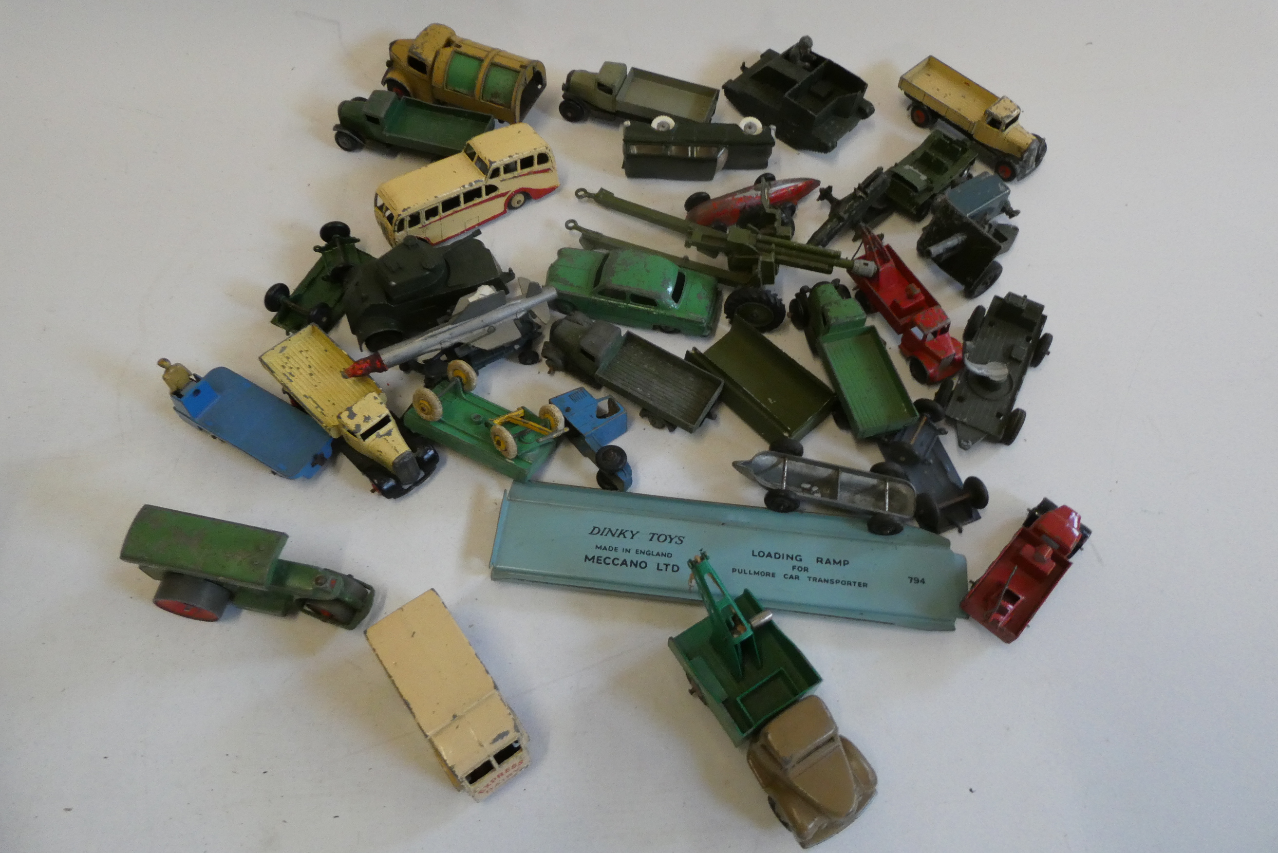 Unboxed diecast vehicles by various makers including Dinky, Crane Express Series and field guns, Image