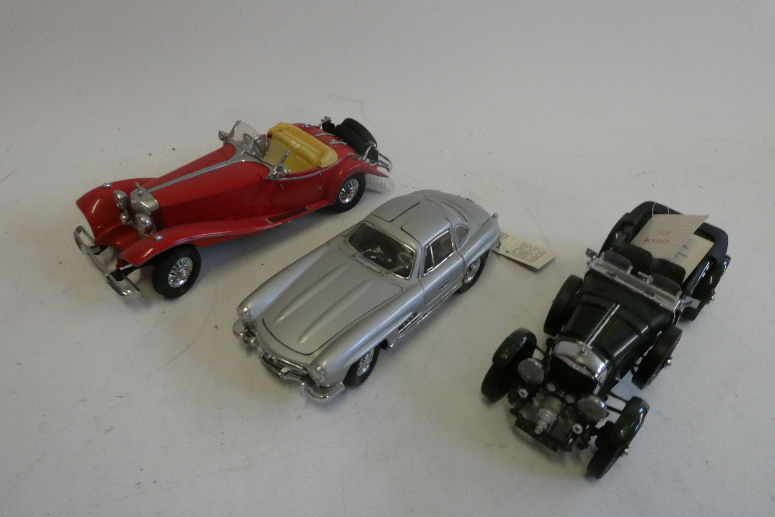 Three Franklin Mint 1/25 scale Classic cars comprising litre Bentley, SSK Mercedes and SL300 Image