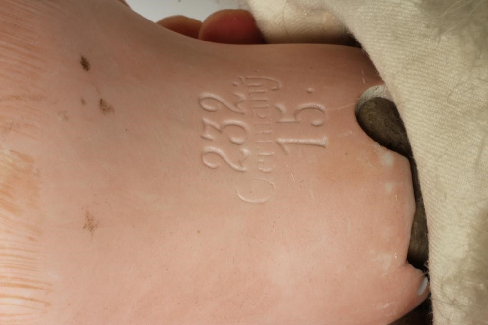 A German bisque head boy character doll Image