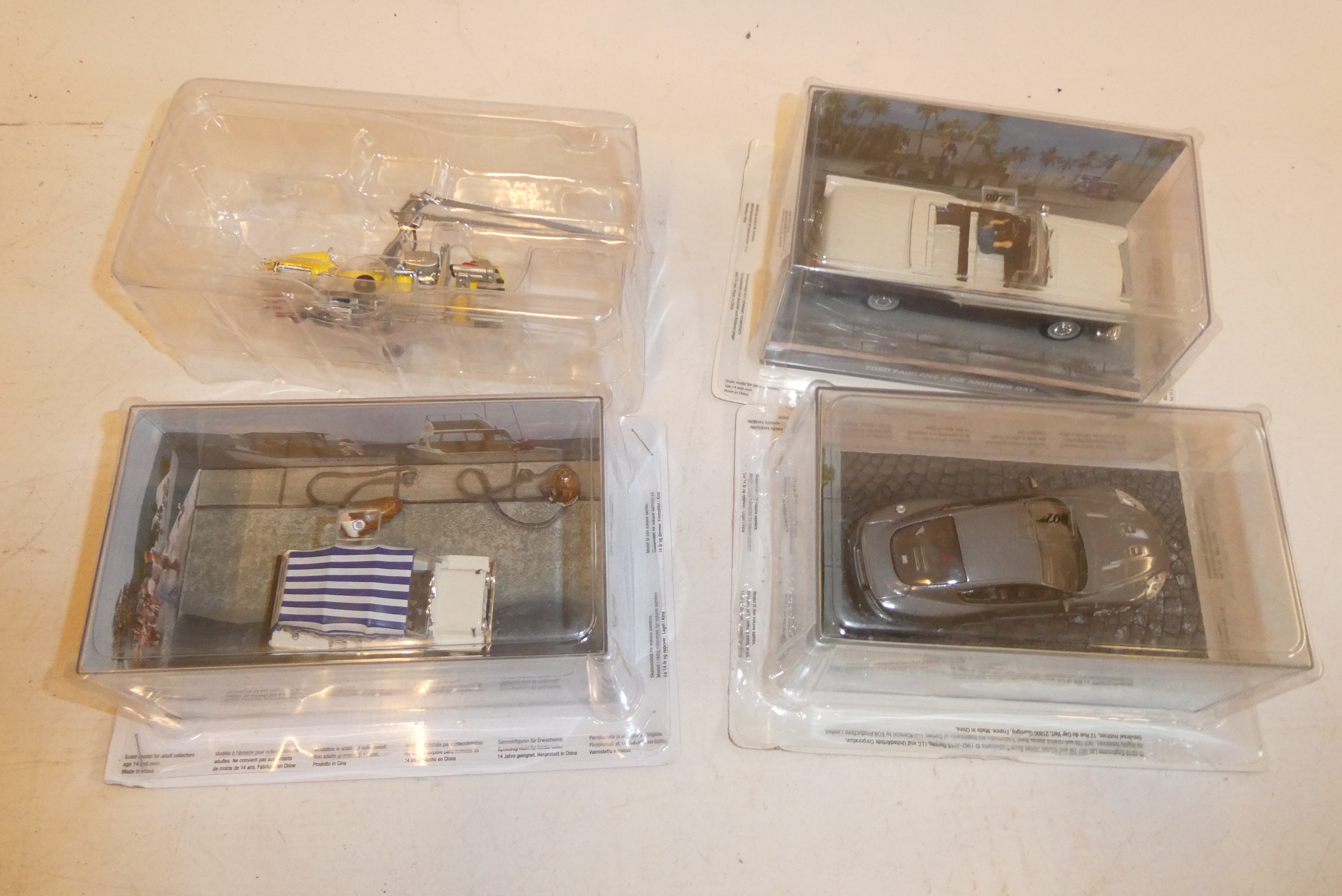 Four Fabbri James Bond vehicles comprising Aston Martin, Vantage Gyrocopter, Mini Moke and Chevrolet Image