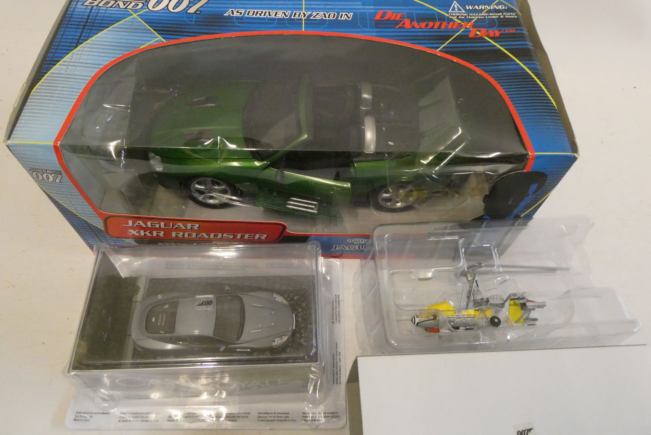Fabbri James Bond Aston Martin DBS, Gyrocopter and James Bond Jaguar XKR, 1:18 scale, boxed, mint Image