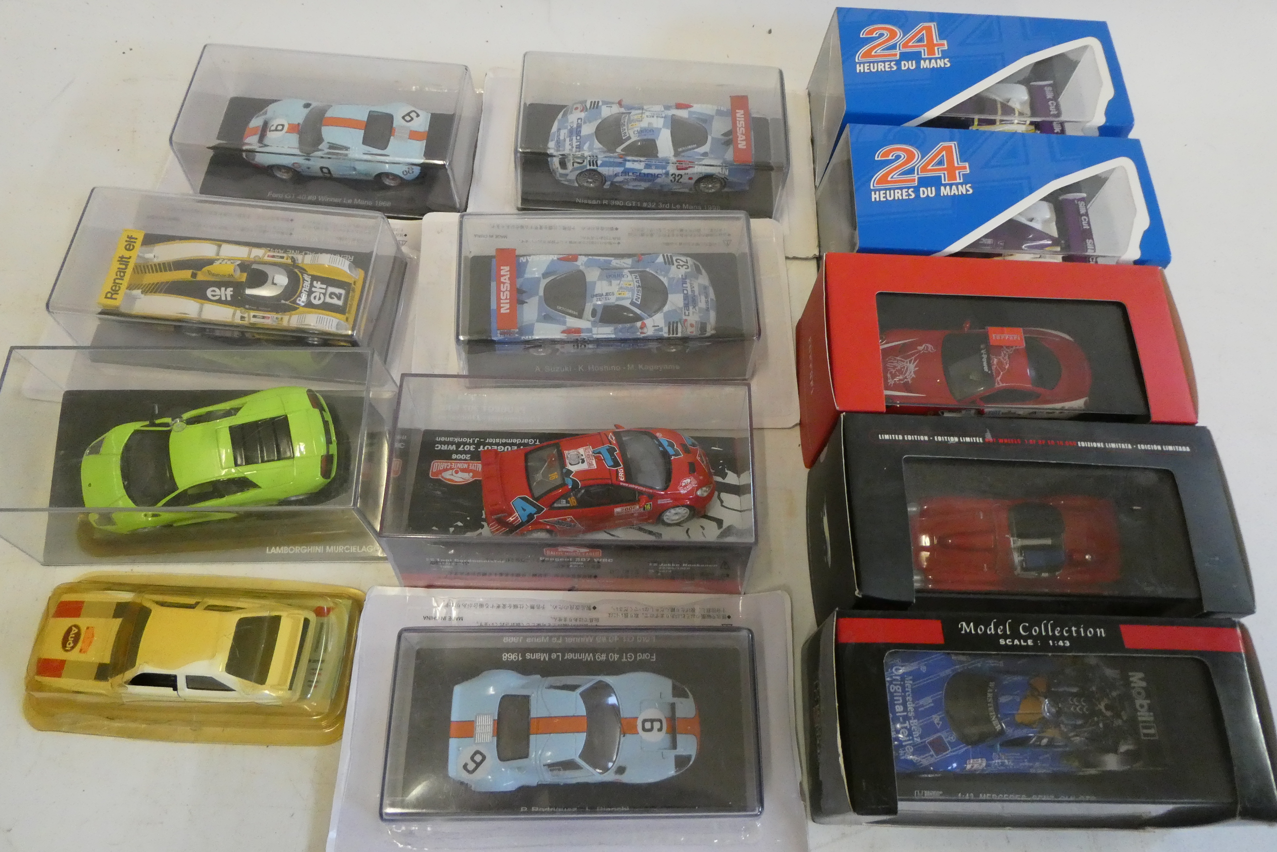 Diecast 1:43 scale Chinese made model racing cars including Ford GT40, Ferrari and Nissan, all items Image