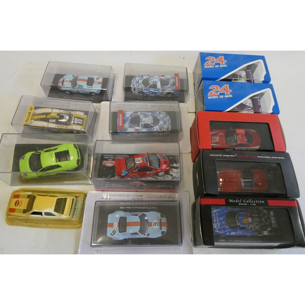 Diecast 1:43 scale Chinese made model racing cars including Ford GT40, Ferrari and Nissan, all items Image