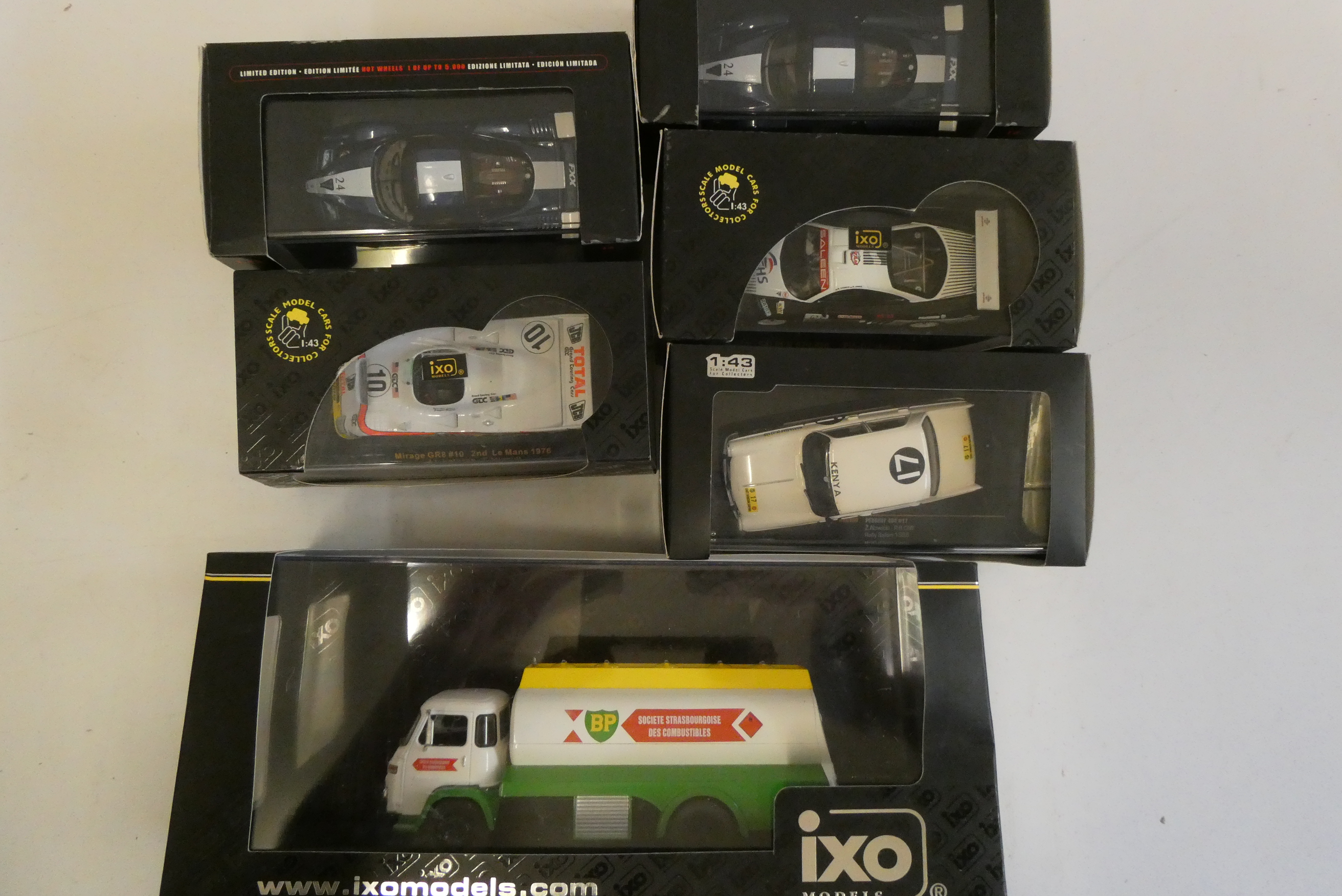 Five 1/43th scale racing cars by IXO models and BP fuel tanker, all items boxed, mint Image