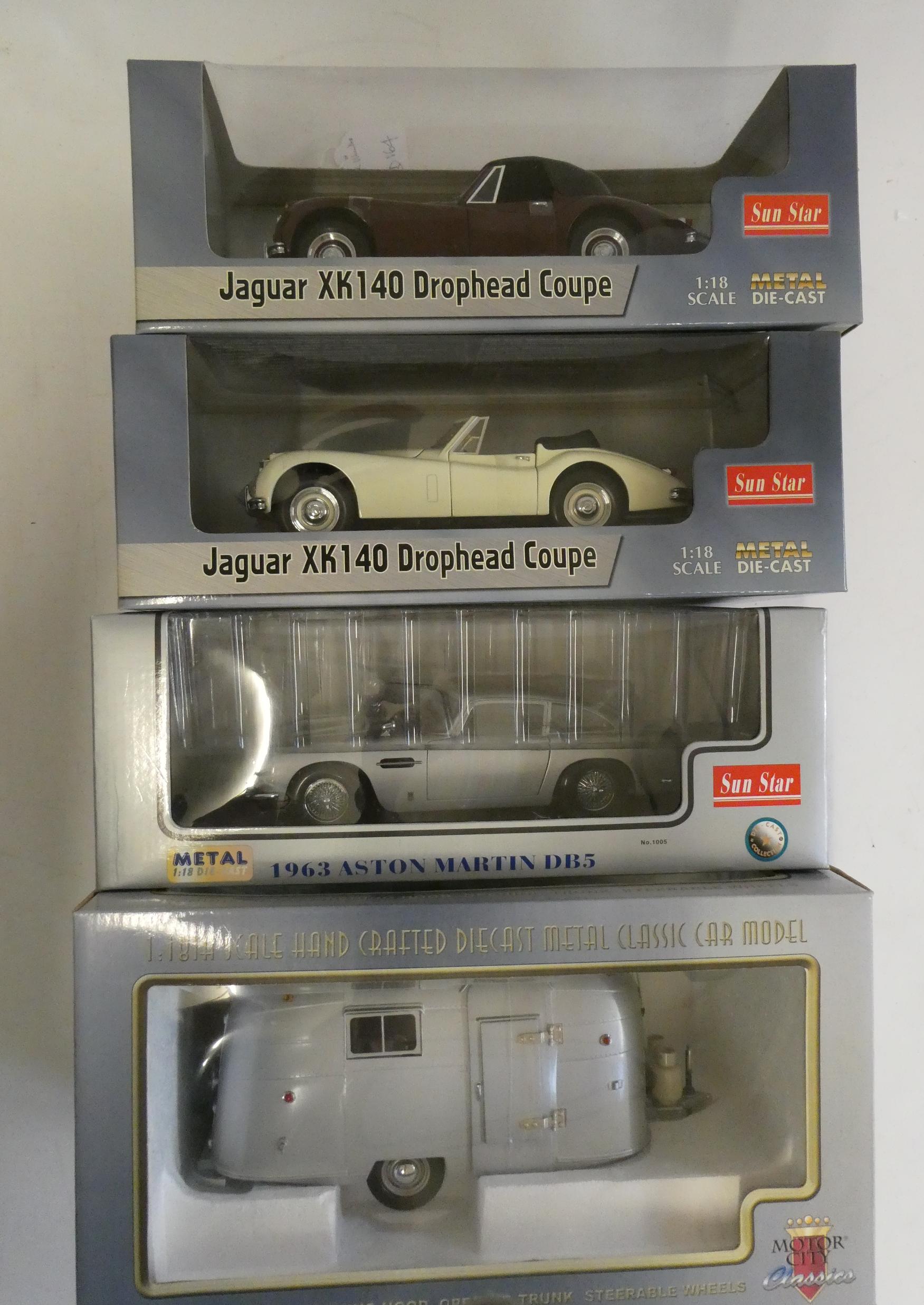 Three Sunstar 1/18th scale cars comprising Jaguar XK 140, Aston Martin DB5 and Motor City Classics Image