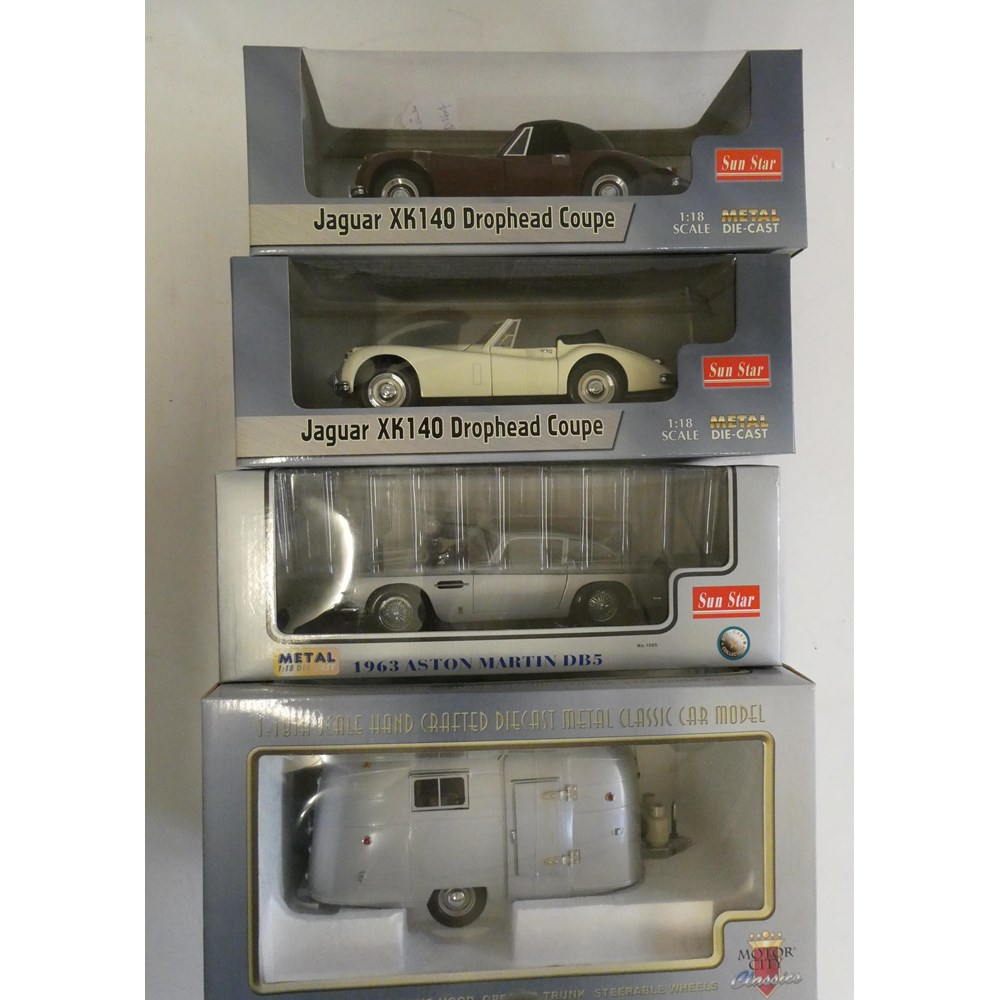 Three Sunstar 1/18th scale cars comprising Jaguar XK 140, Aston Martin DB5 and Motor City Classics Image