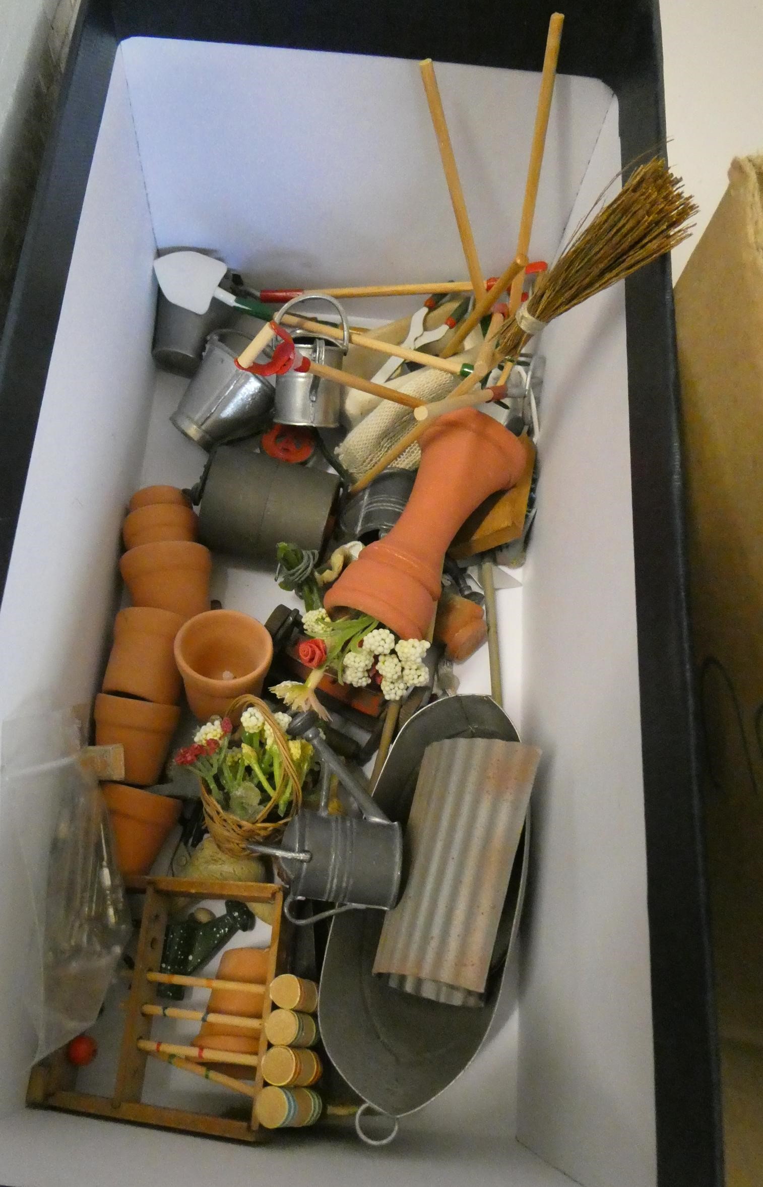 A collection of doll's house garden and outdoor items, including a privy, mowers, croquet set, faux Image