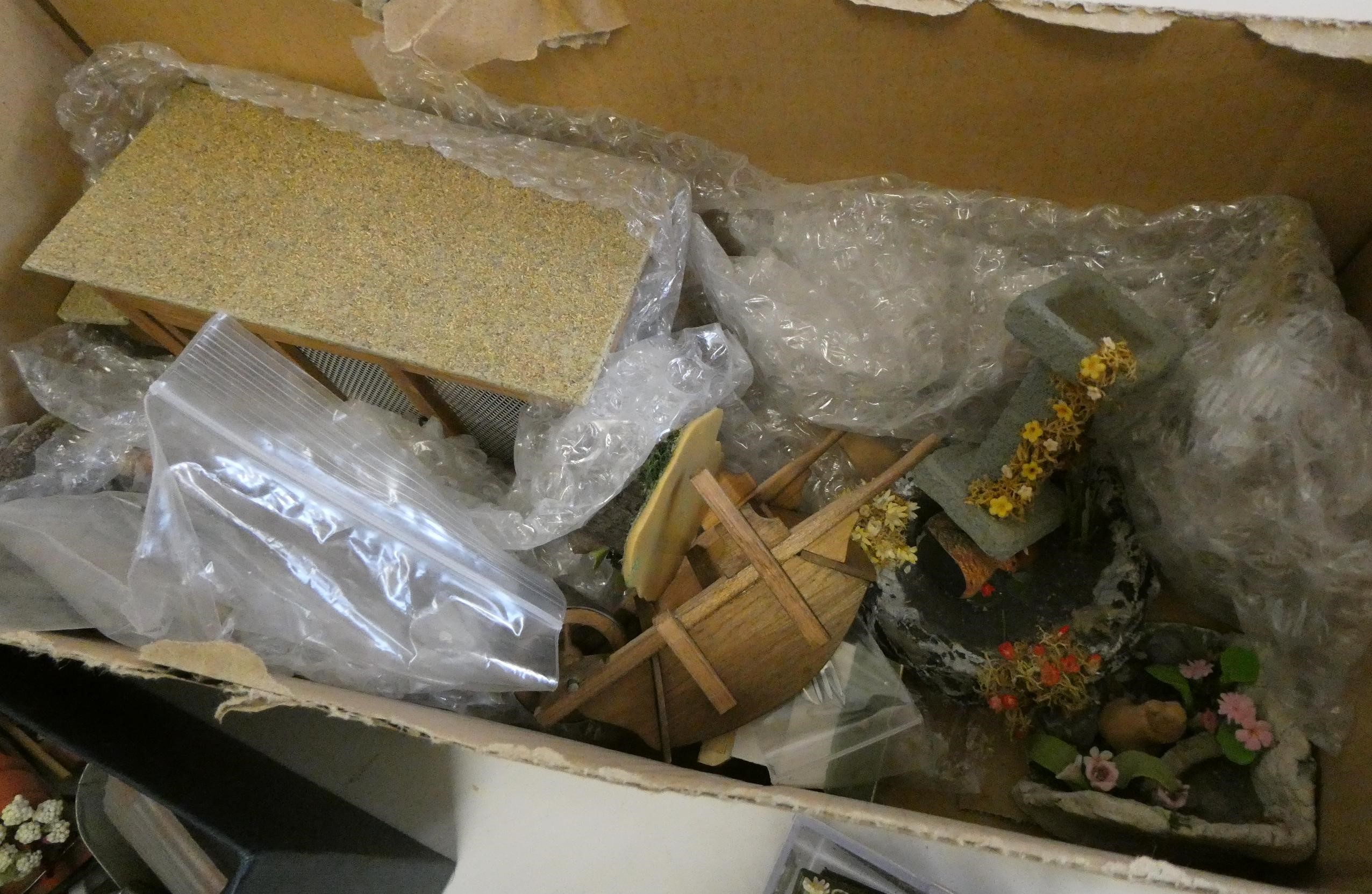 A collection of doll's house garden and outdoor items, including a privy, mowers, croquet set, faux Image