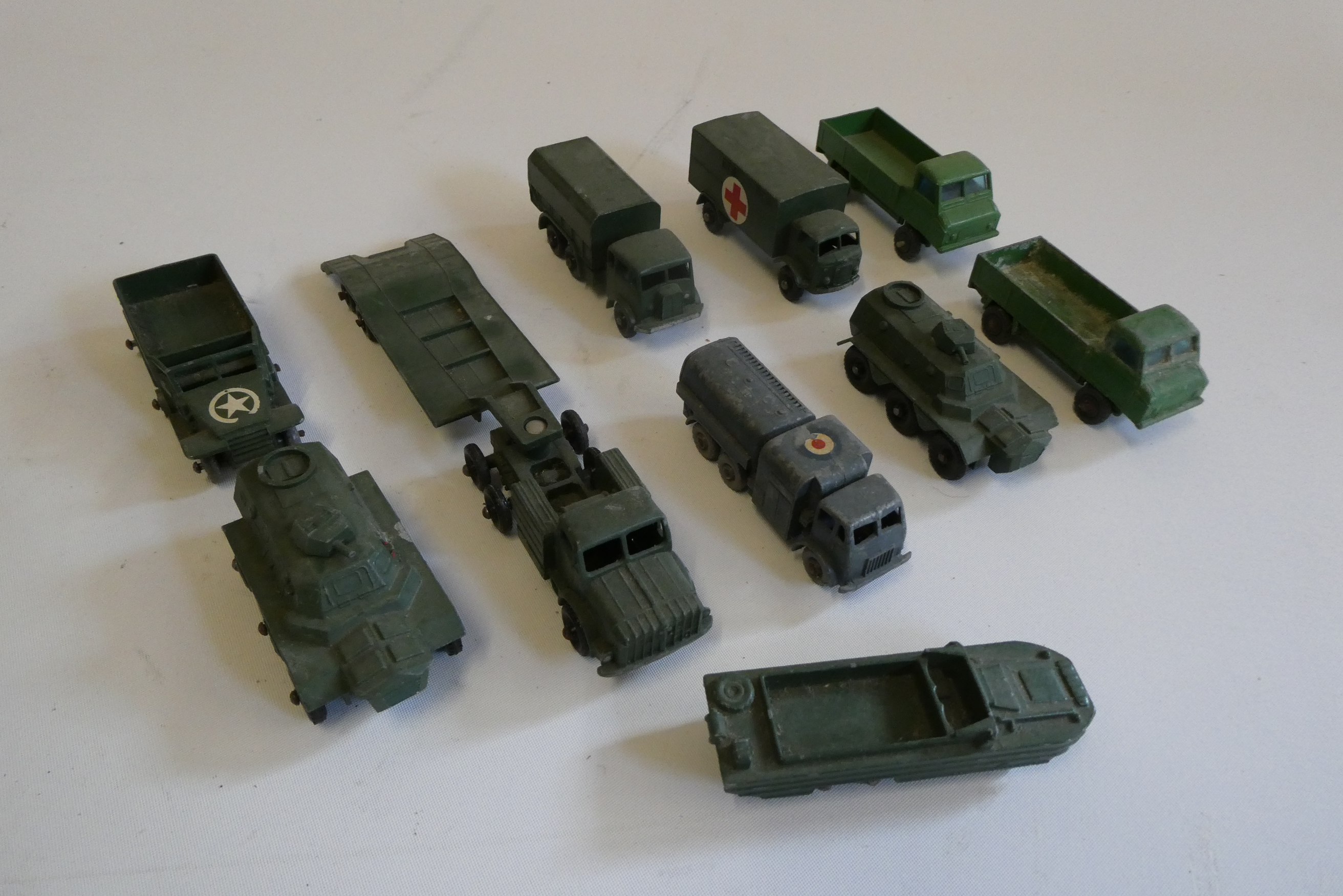 Eight Matchbox military vehicles including tank transporter, ambulance and 10 tonne truck, all items Image