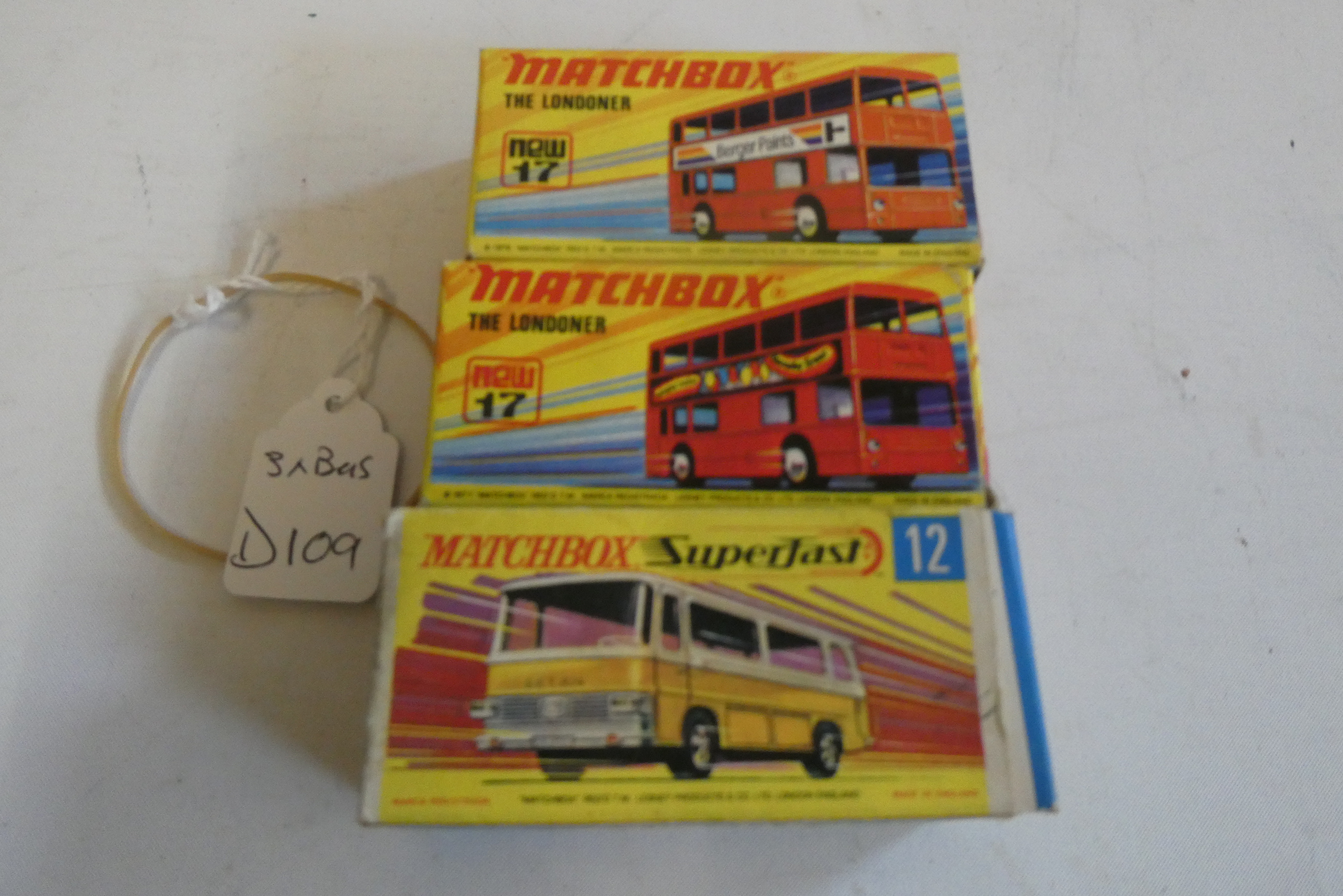 Three Matchbox Superfast Bus models comprising No.12 Setra yellow Coach and two No.17 red London Image