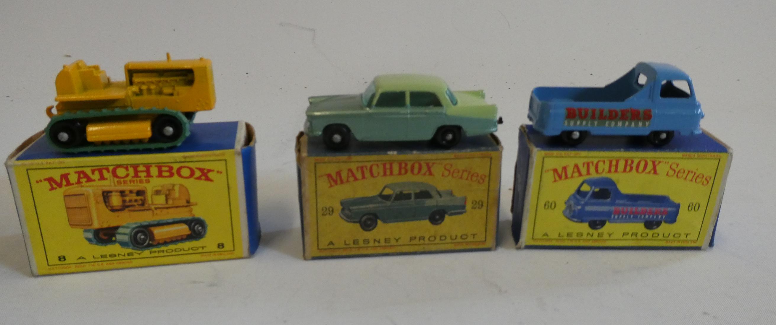 Three Matchbox vehicles comprising No.8 Caterpillar Tractor, No.29 Austin A55 Cambridge and No.60 Image