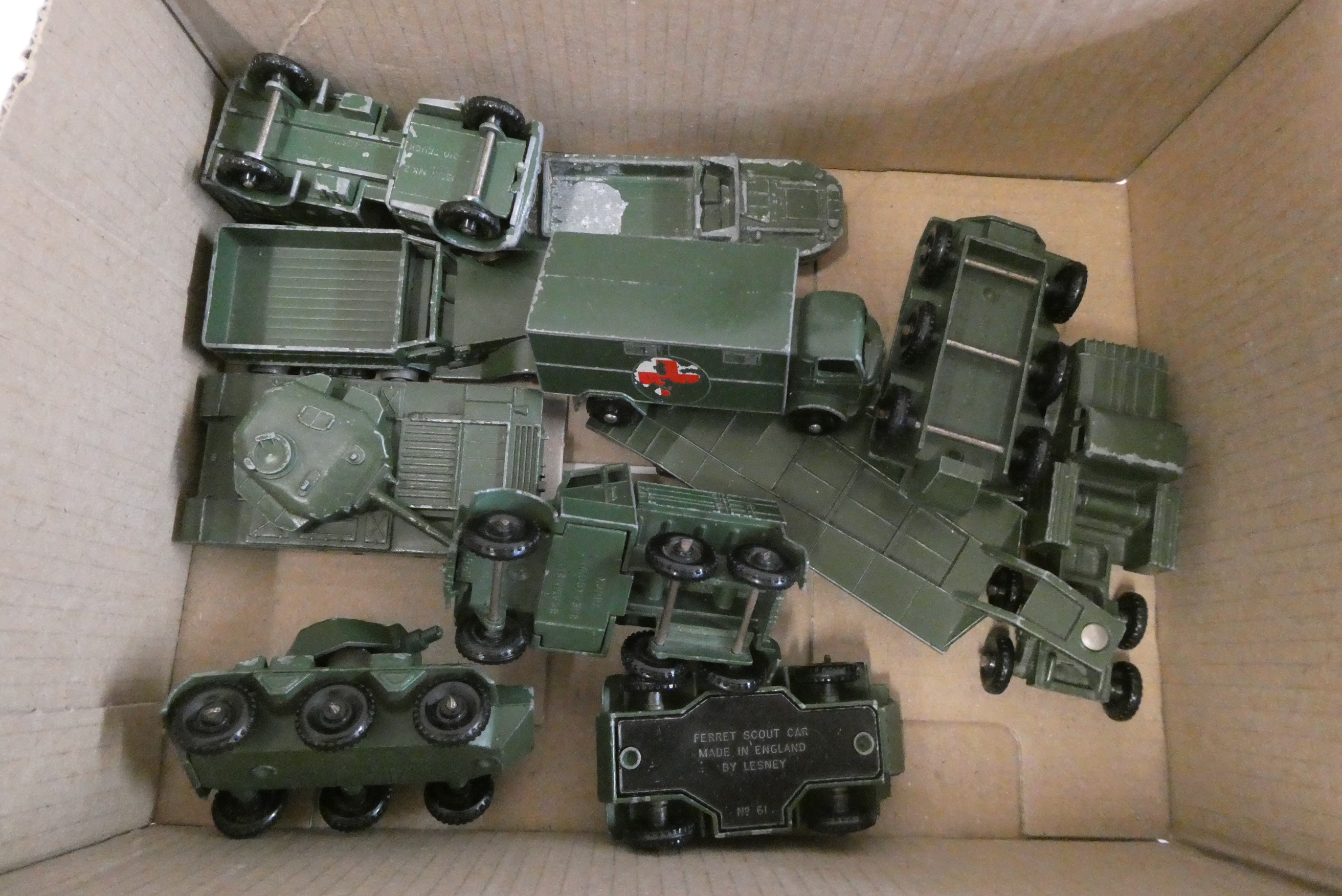 Ten unboxed Matchbox army vehicles including tank transporter, green truck, tank and ambulance, fair Image