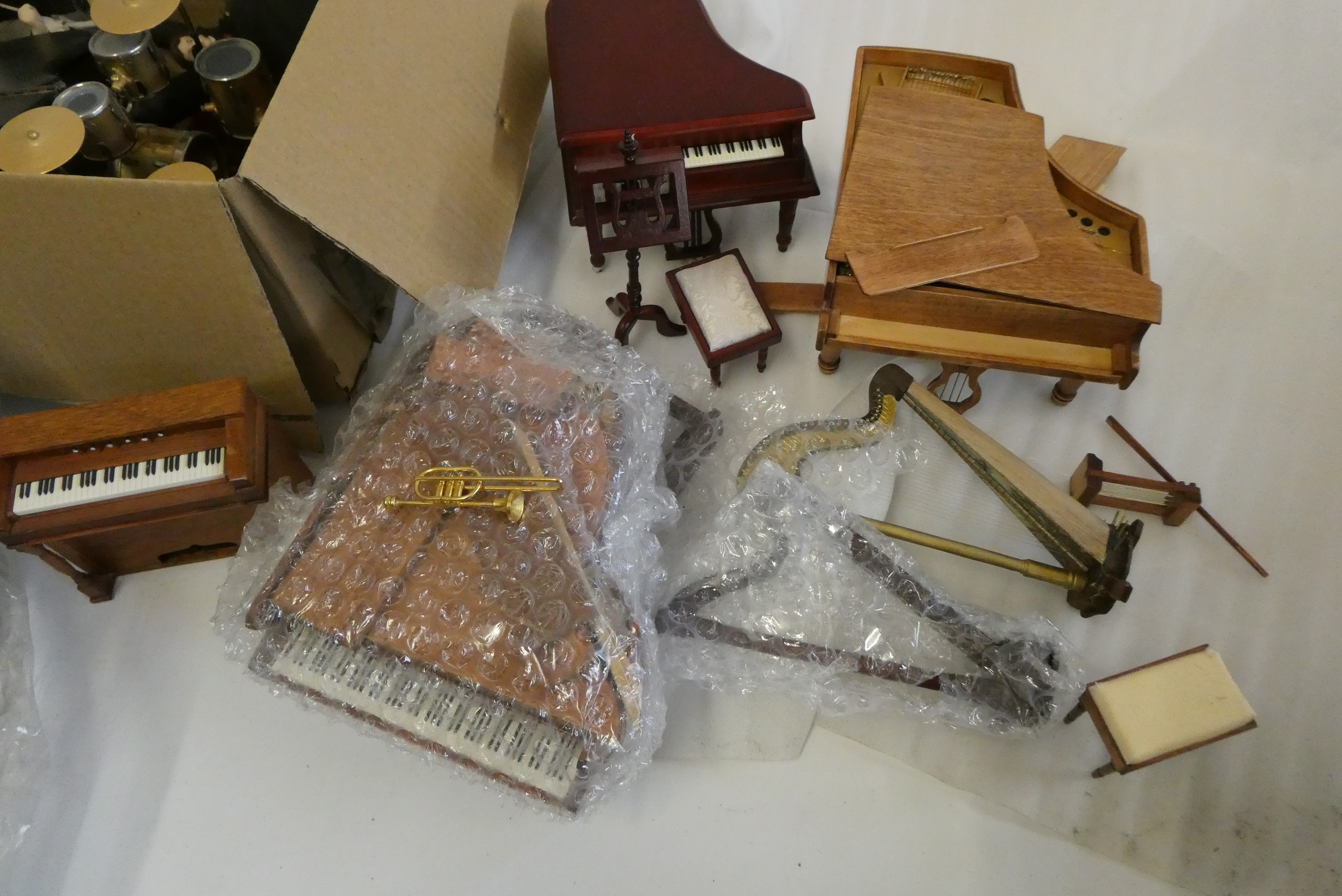 A large collection of doll's house musical room and associated items, including a model Wurlitzer Image