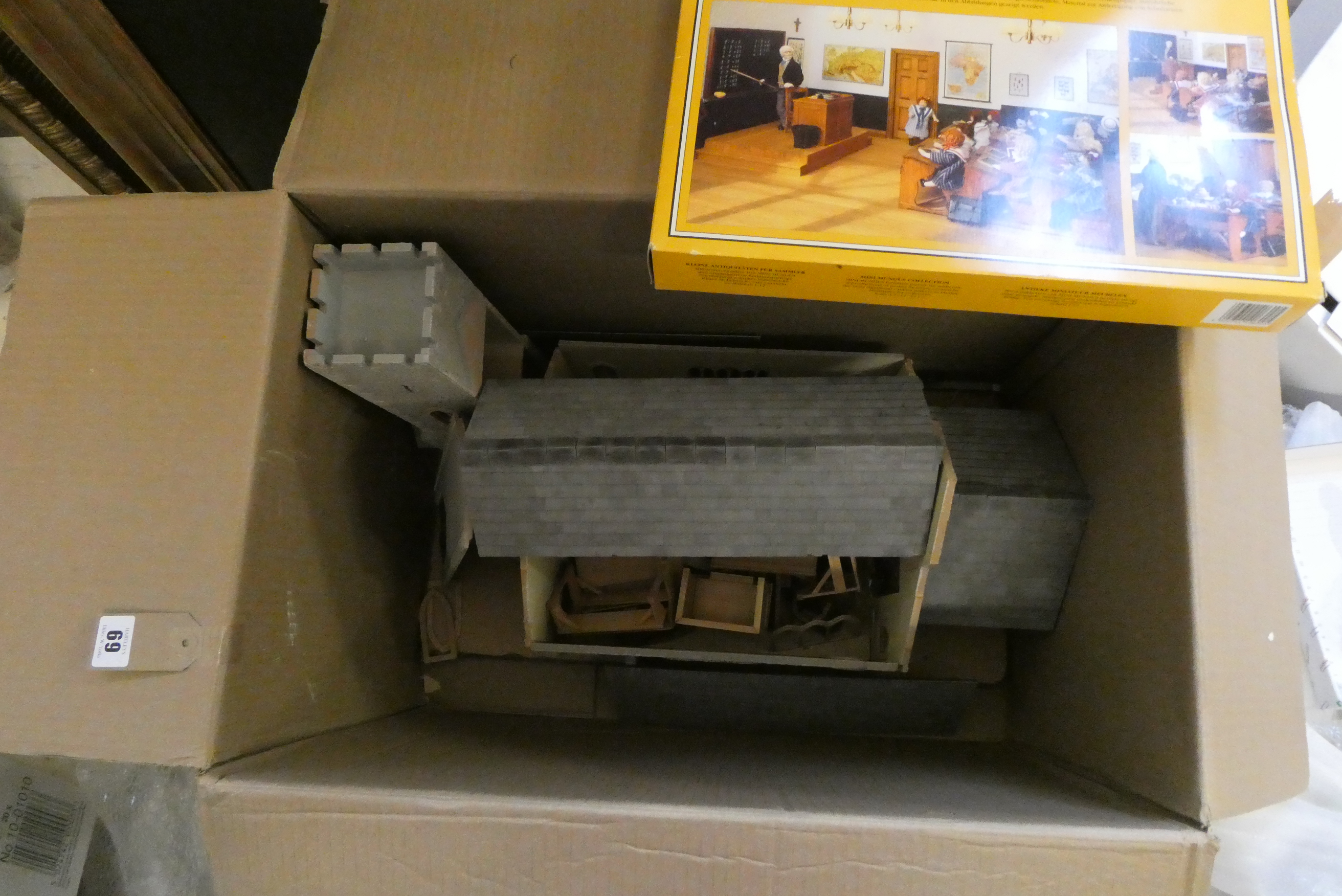 A doll's house church of wood construction with furniture including lectern, pews and school desks, Image