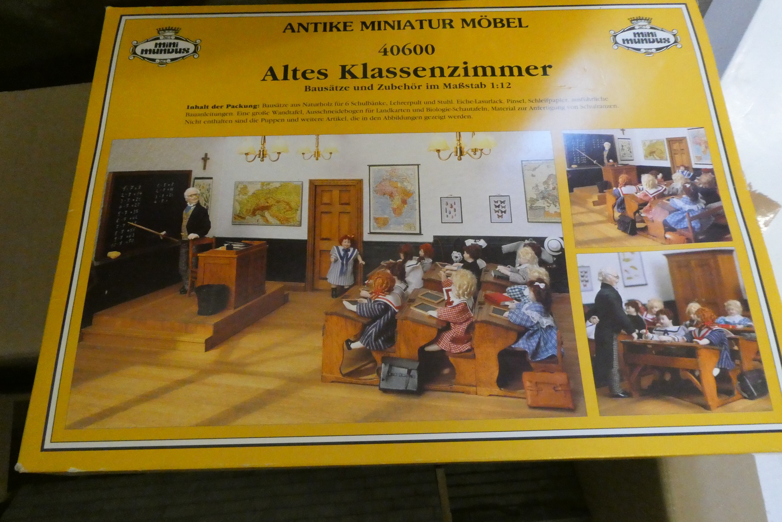 A doll's house church of wood construction with furniture including lectern, pews and school desks, Image