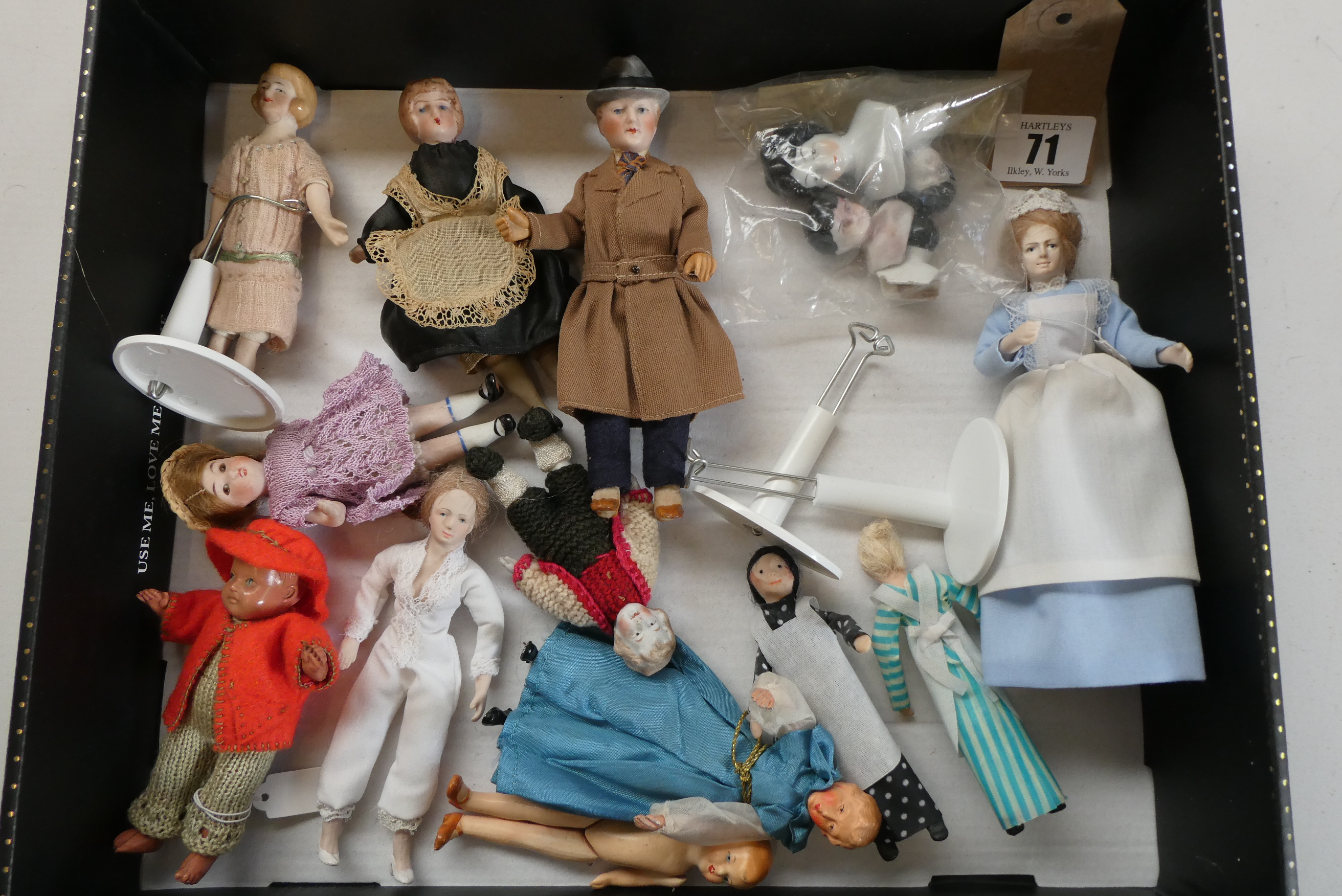 A small collection of dolls house dolls including antique bisque examples, Victorian china busts and Image