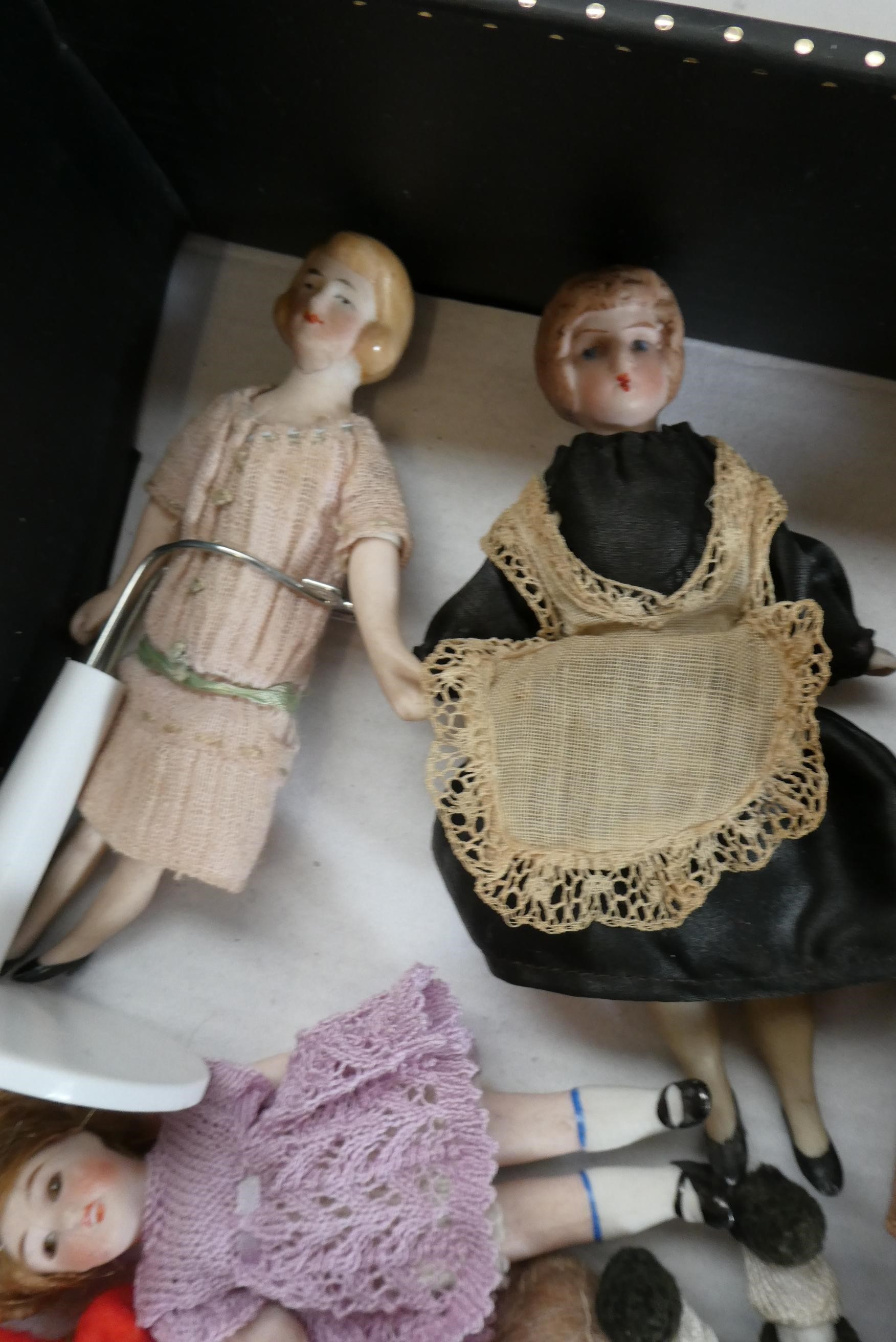 A small collection of dolls house dolls including antique bisque examples, Victorian china busts and Image