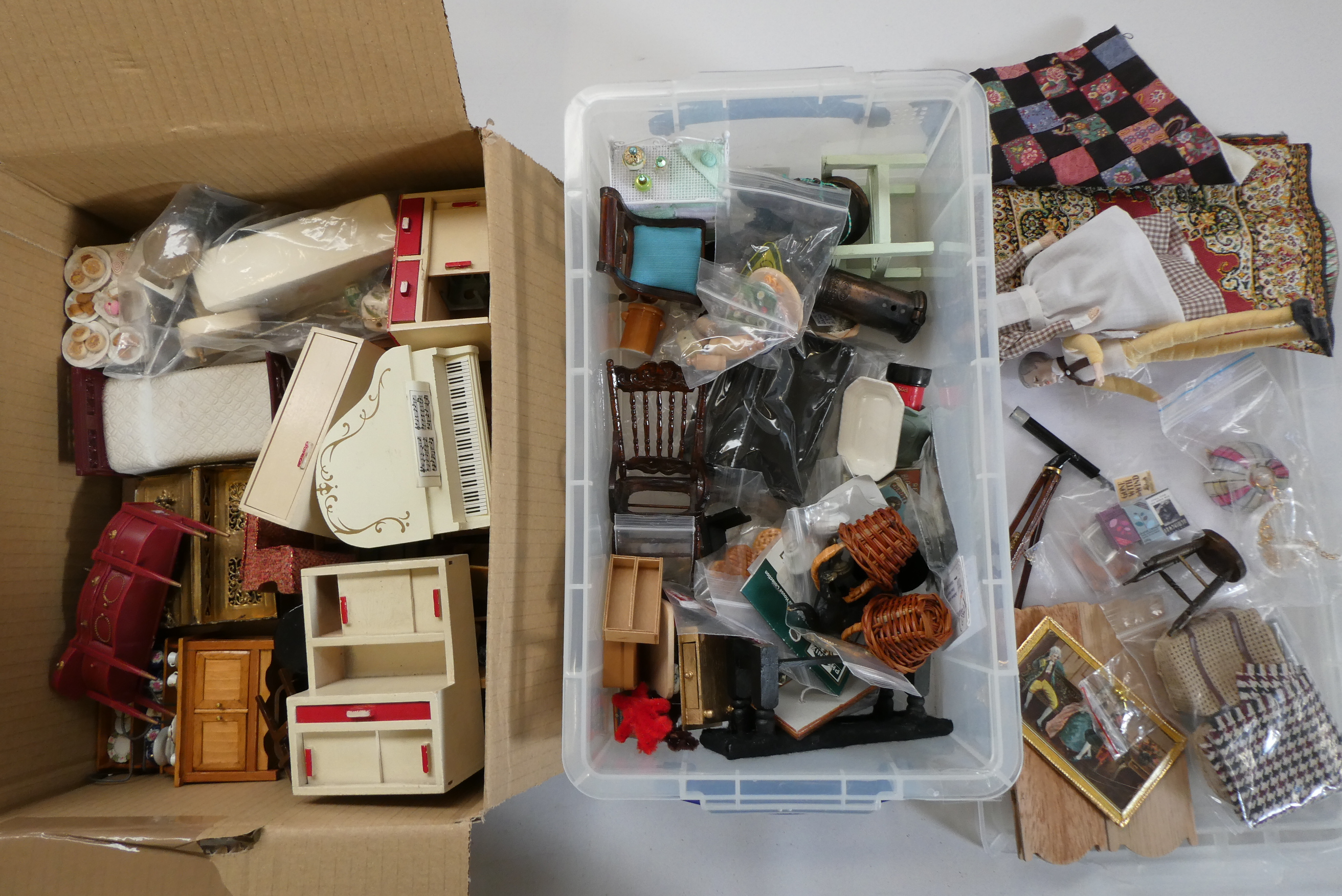 Two boxes of dolls house furniture and accessories, including wood, metal and textile items Image