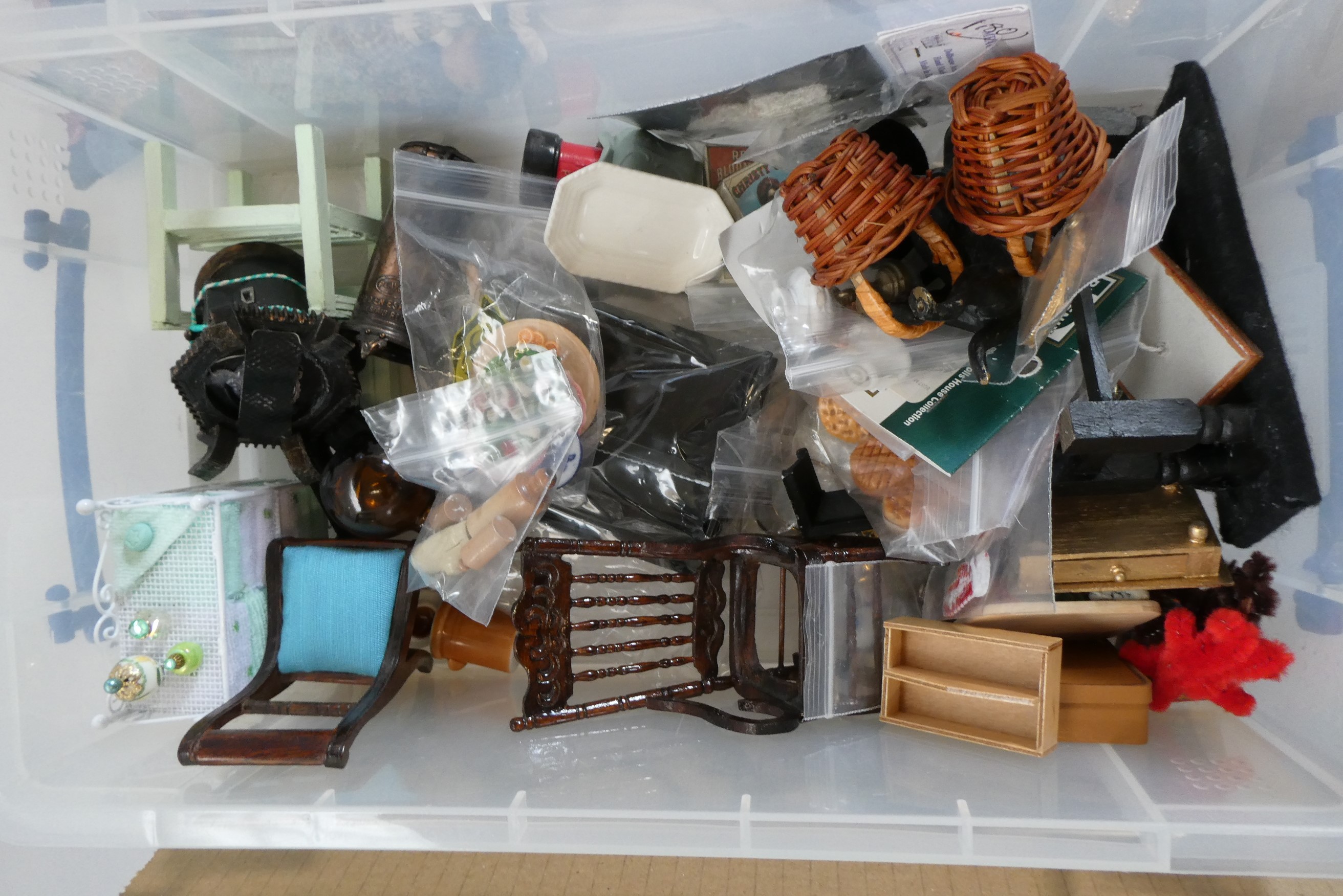 Two boxes of dolls house furniture and accessories, including wood, metal and textile items Image