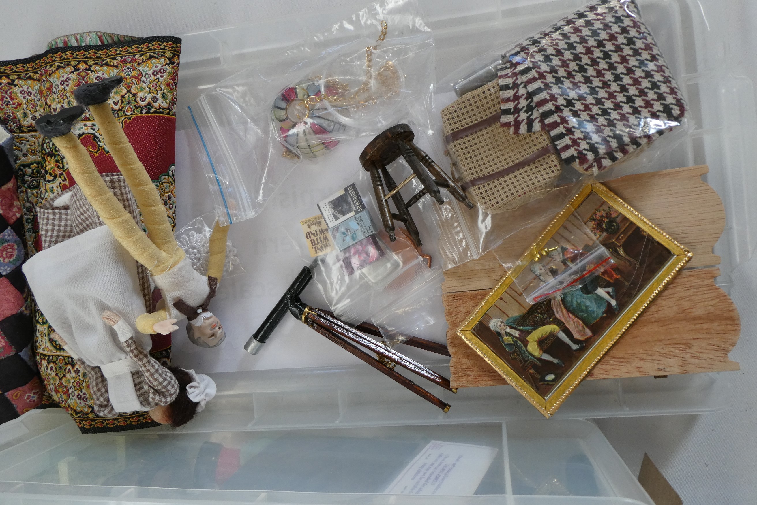 Two boxes of dolls house furniture and accessories, including wood, metal and textile items Image