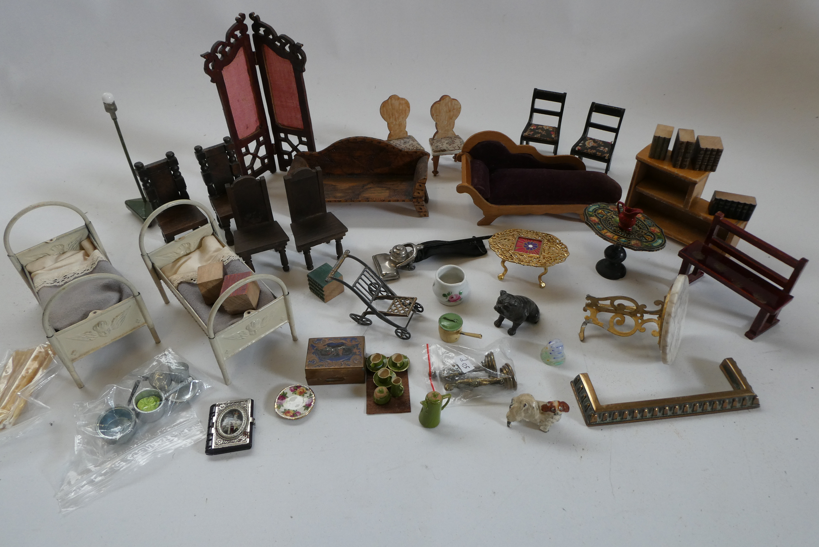 Box of antique dolls house furniture and accessories, including wood and metal examples Image