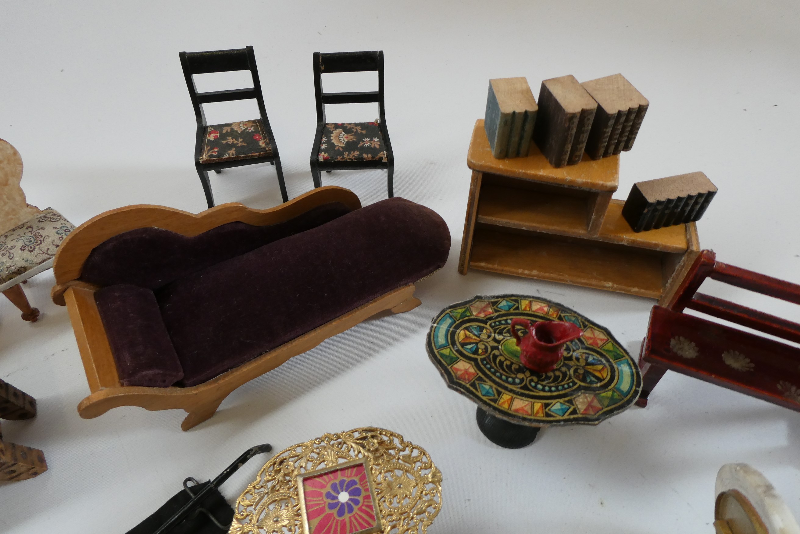 Box of antique dolls house furniture and accessories, including wood and metal examples Image