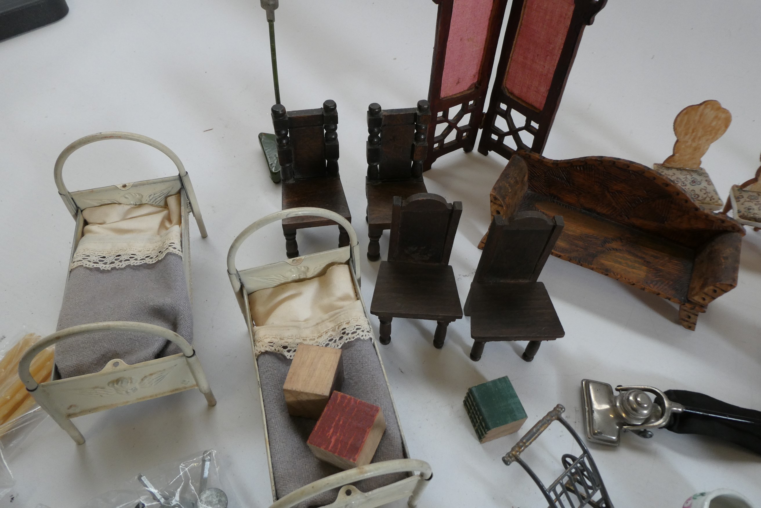 Box of antique dolls house furniture and accessories, including wood and metal examples Image