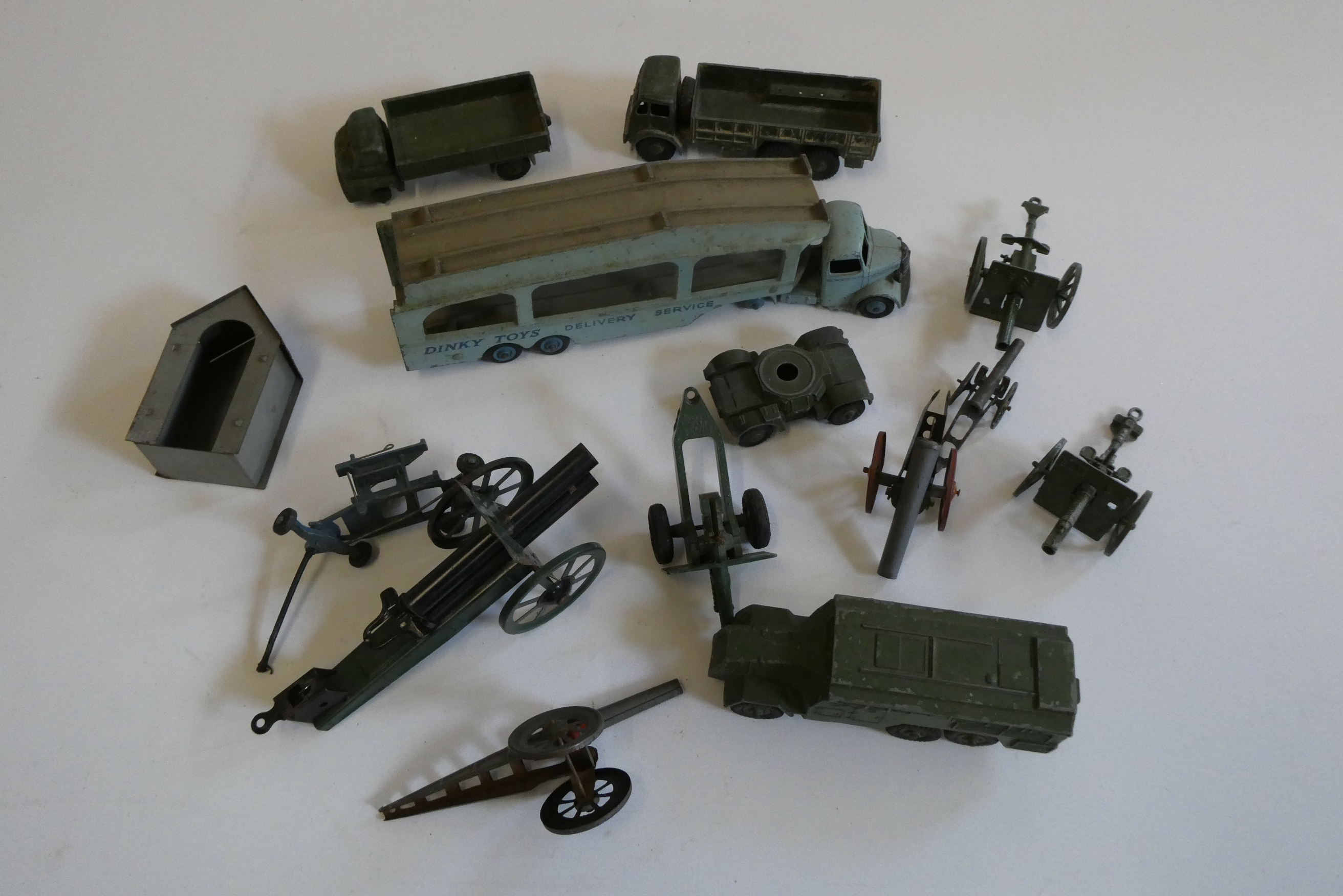 Playworn military vehicles by Dinky and others including filled guns and trucks, and a Dinky Image