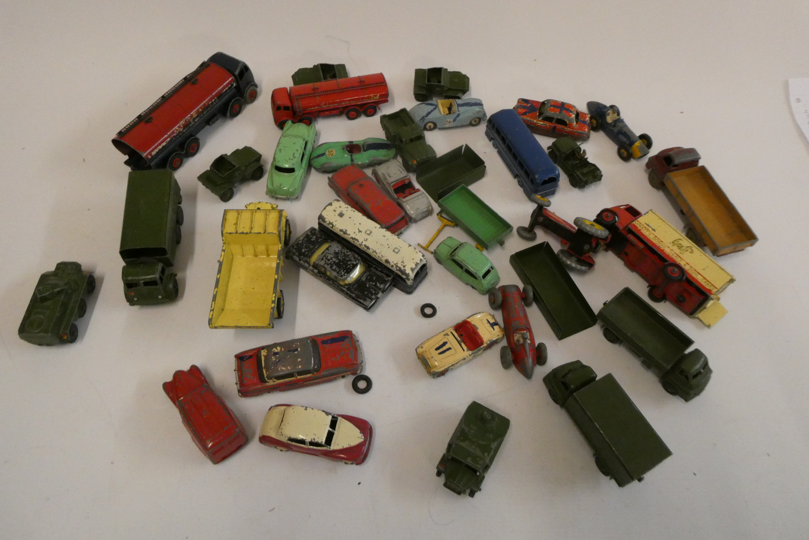 Playworn Dinky vehicles including cars, trucks, army vehicles and race cars, most items have paint Image
