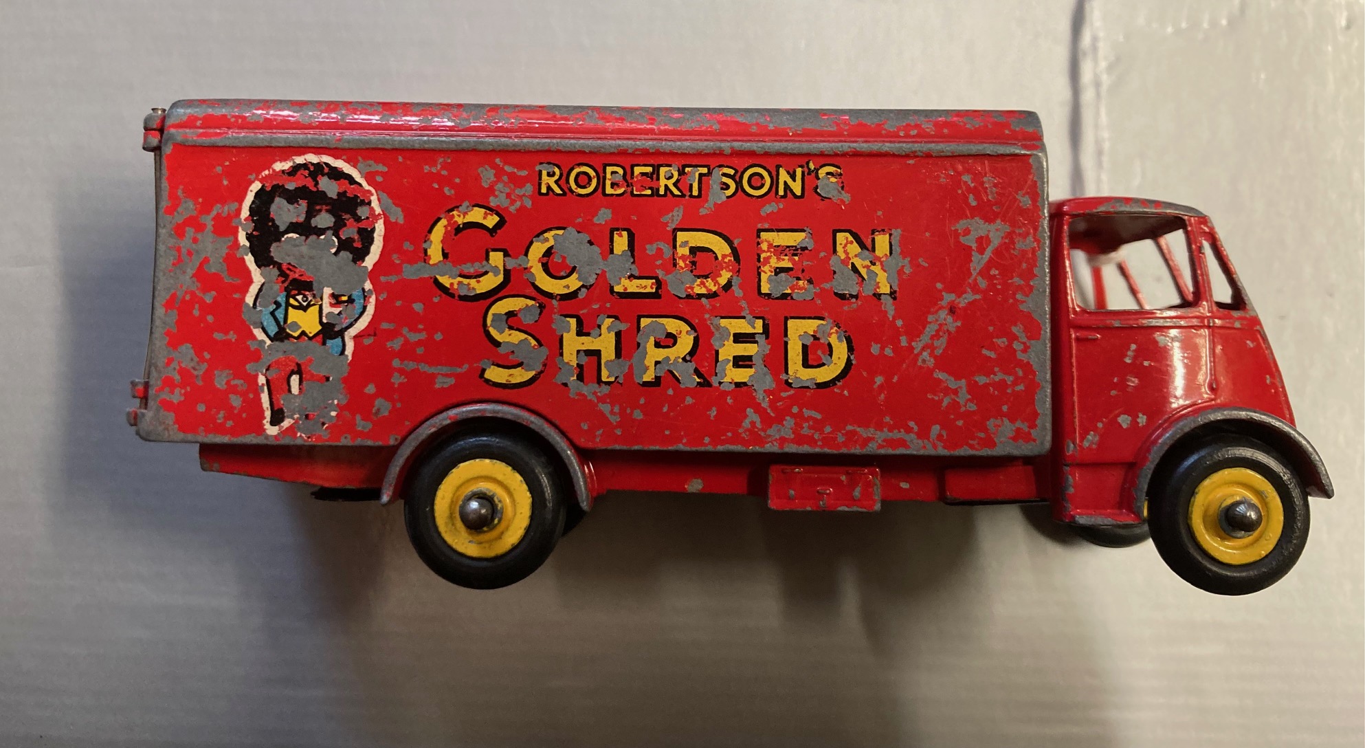 Playworn Dinky Guy van Robertsons Golden Shred, damage to paintwork and side transfer Image