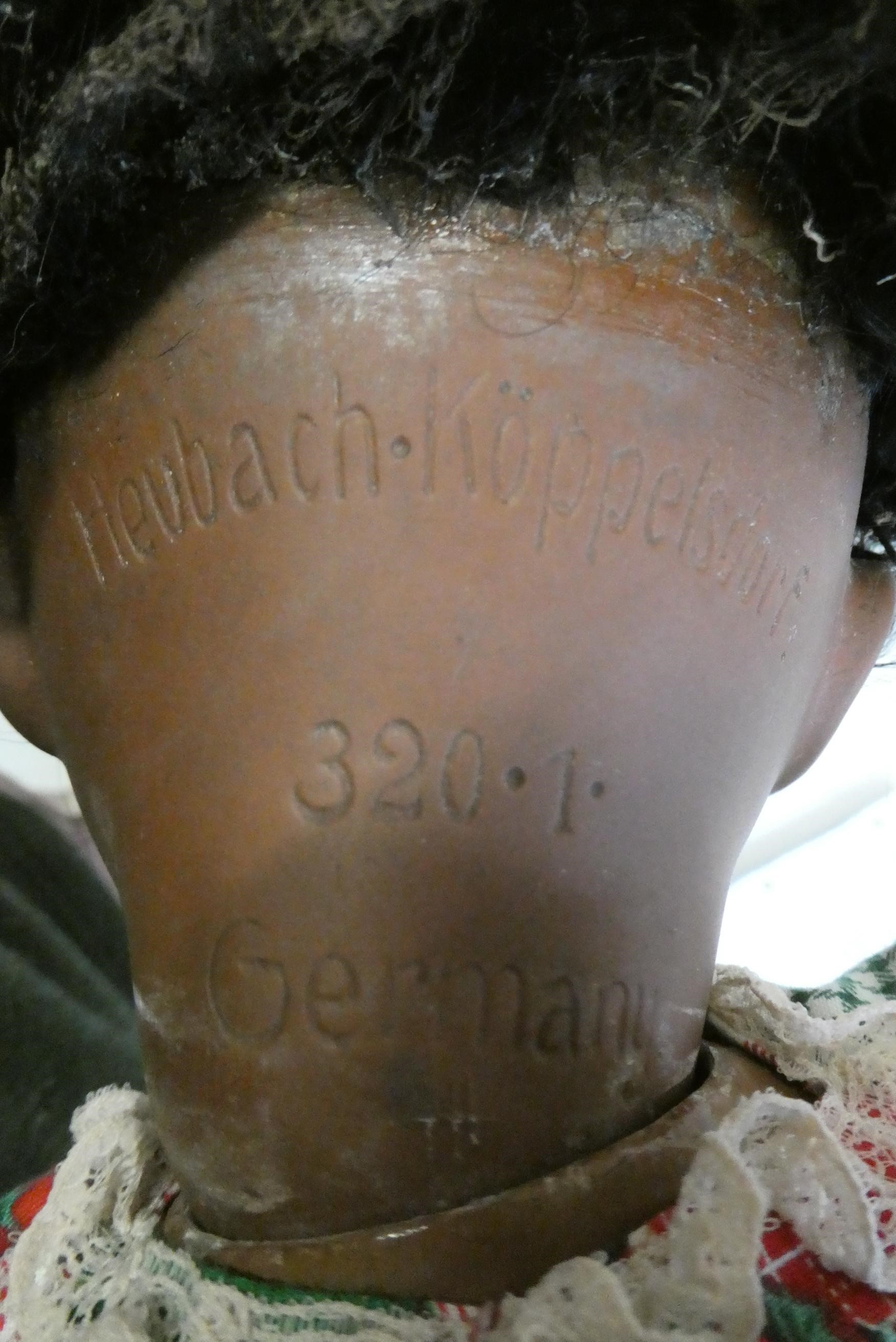 A Heubach Koppelsdorf bisque shoulder head doll, with brown glass sleeping eyes, open mouth applied Image