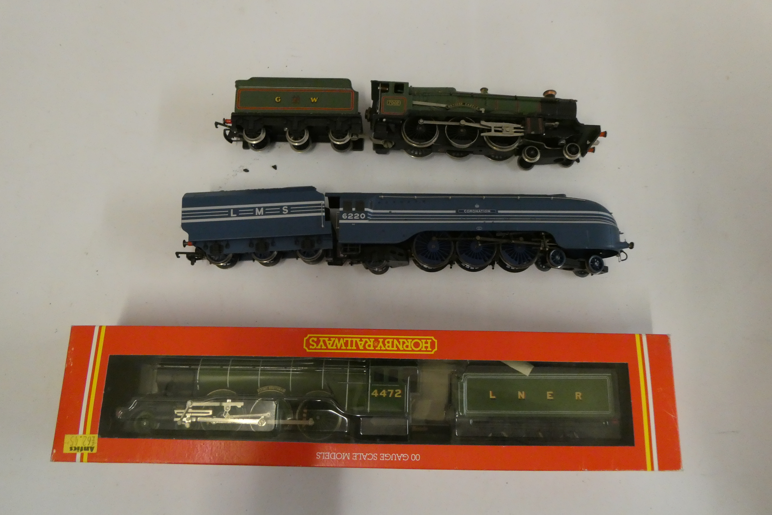 Hornby Flying Scotsman locomotive in LNER green, Coronation locomotive in LMS blue, and Wrenn Image