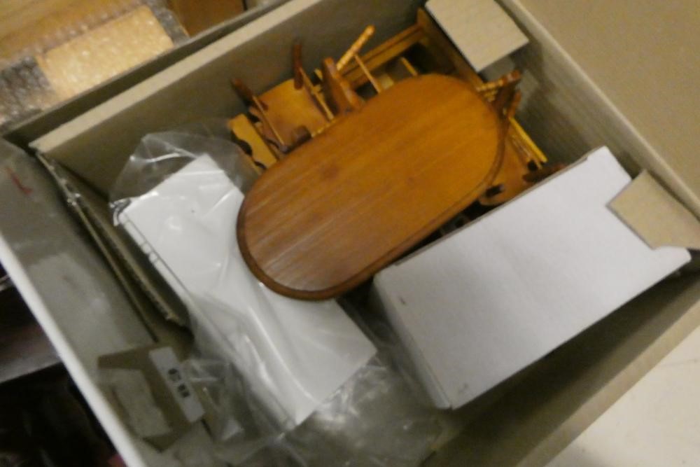 Five boxes of dolls house furniture and accessories, including wood furniture, upholstered suites Image